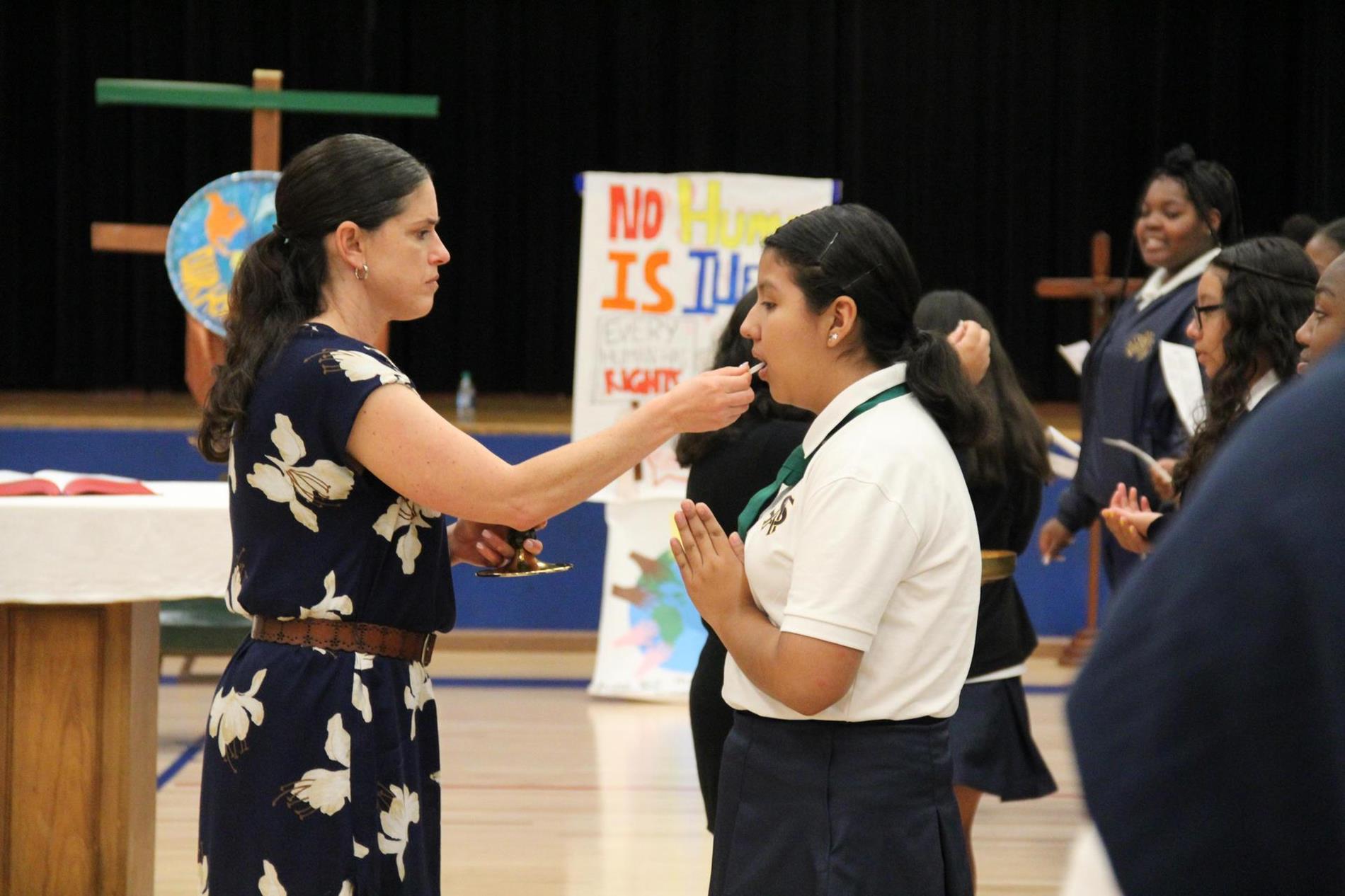 student receiving communion