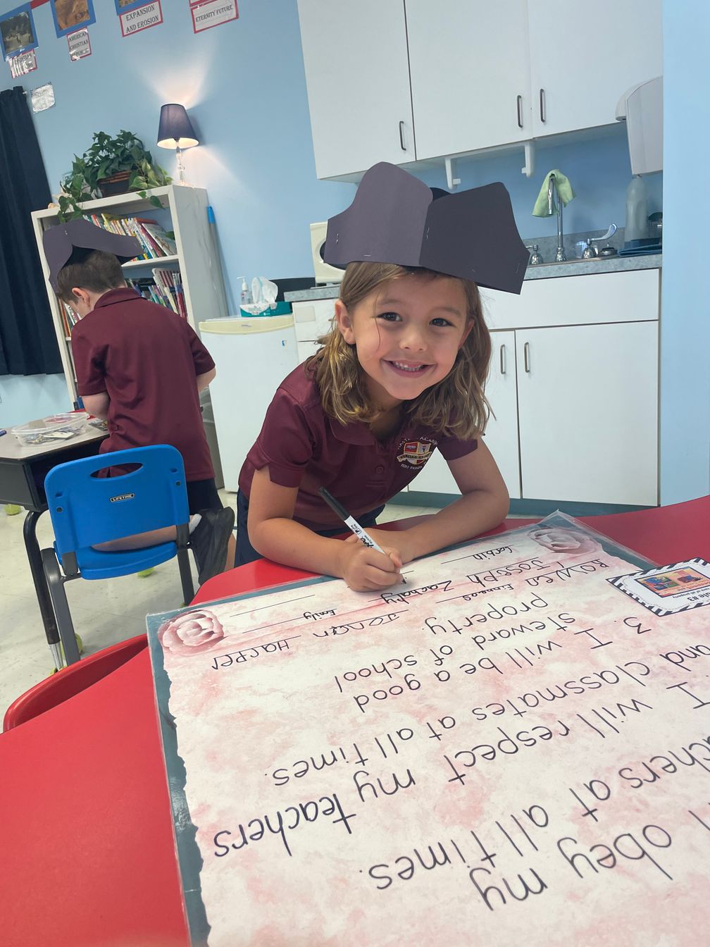 lower school student working on craft project
