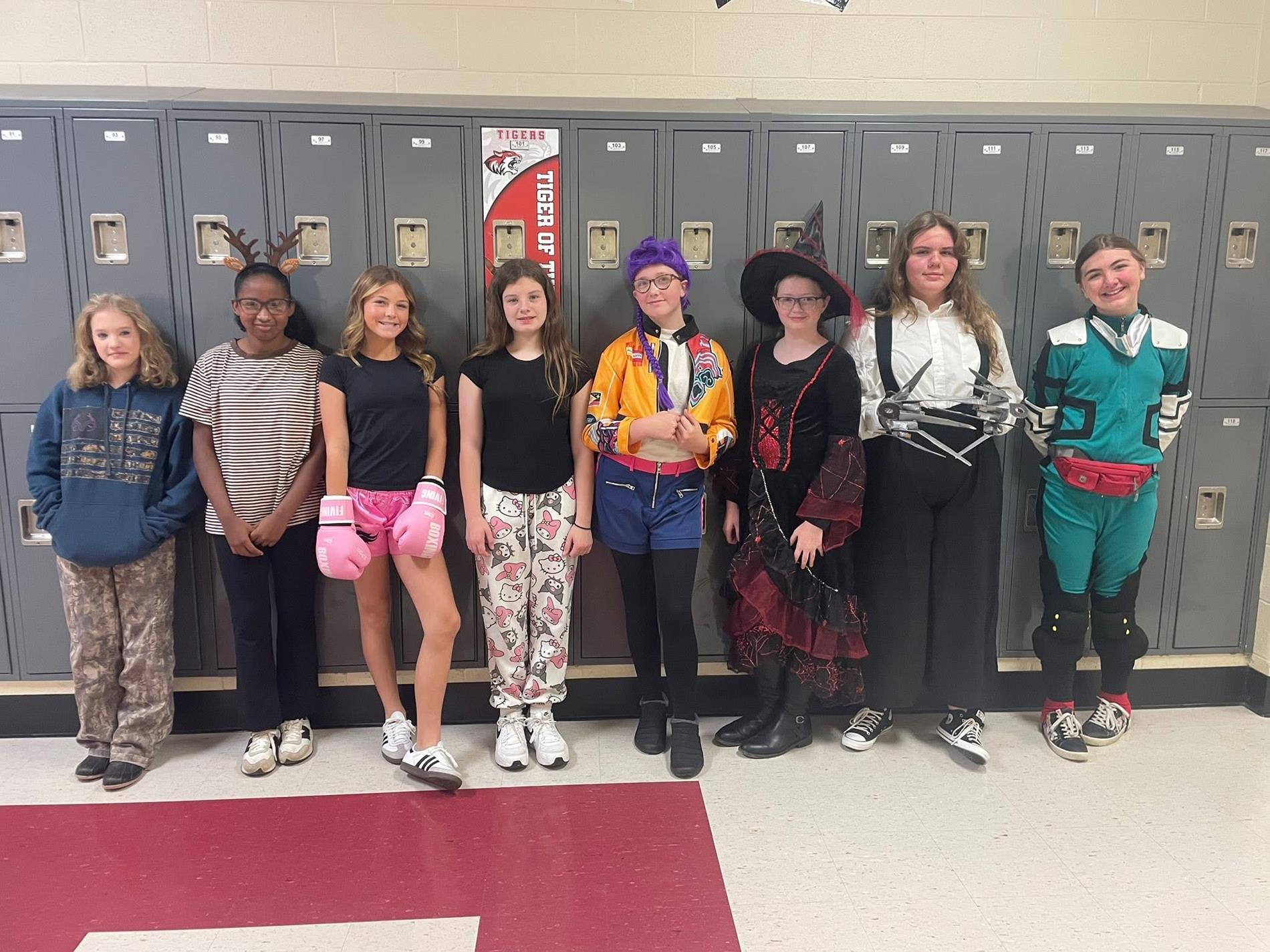 Group of students dressed in costumes for Halloween