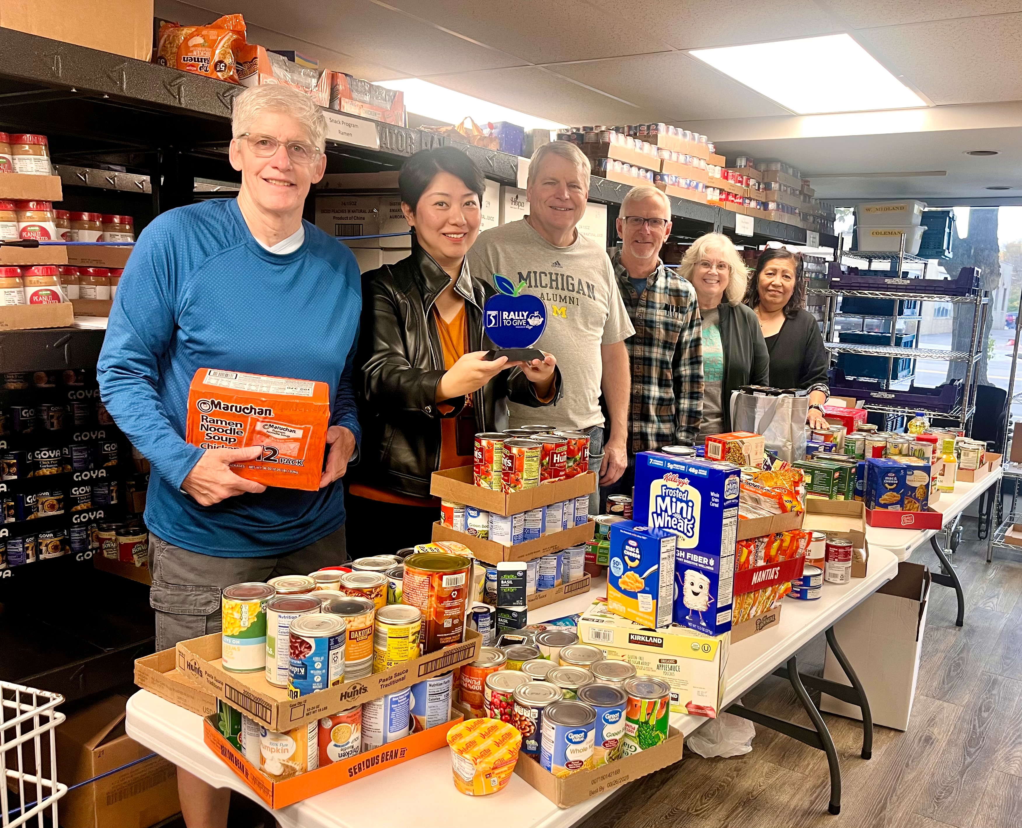 MCFAN volunteers with Dr. Yang Jiao posed with food donations