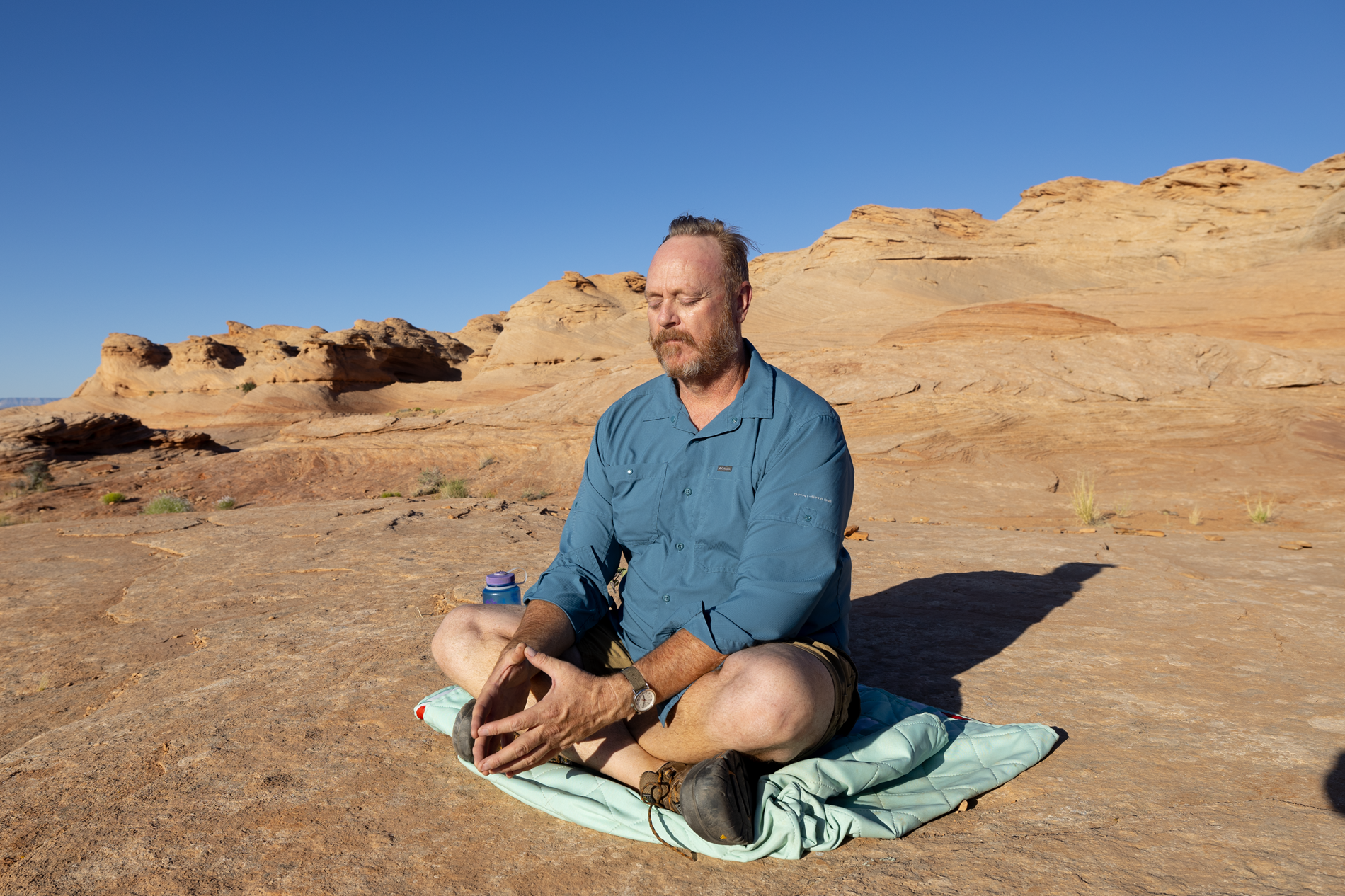 Steven meditating in the desert