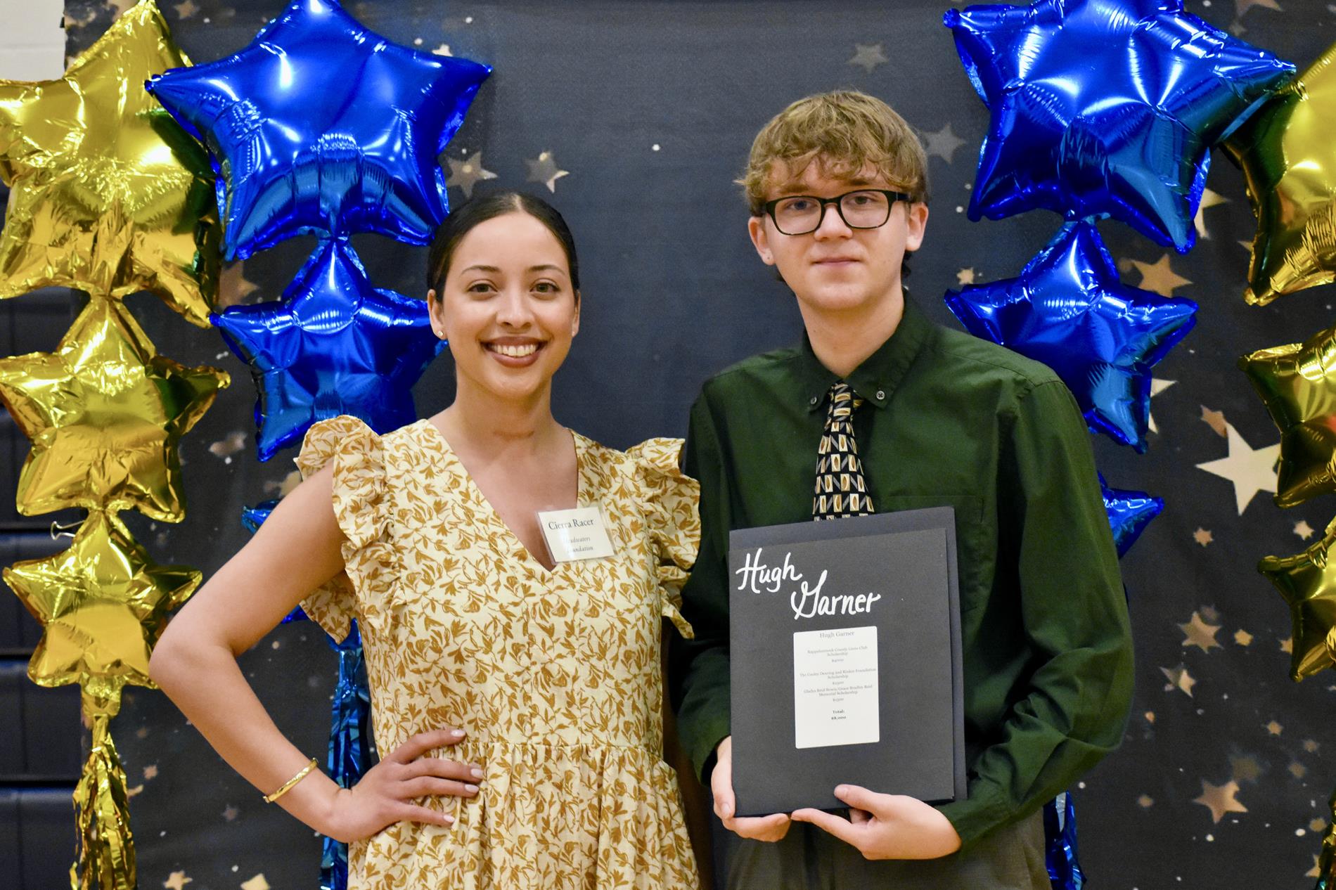 Cierra Racer of Headwaters celebrates with senior Hugh Garner 
