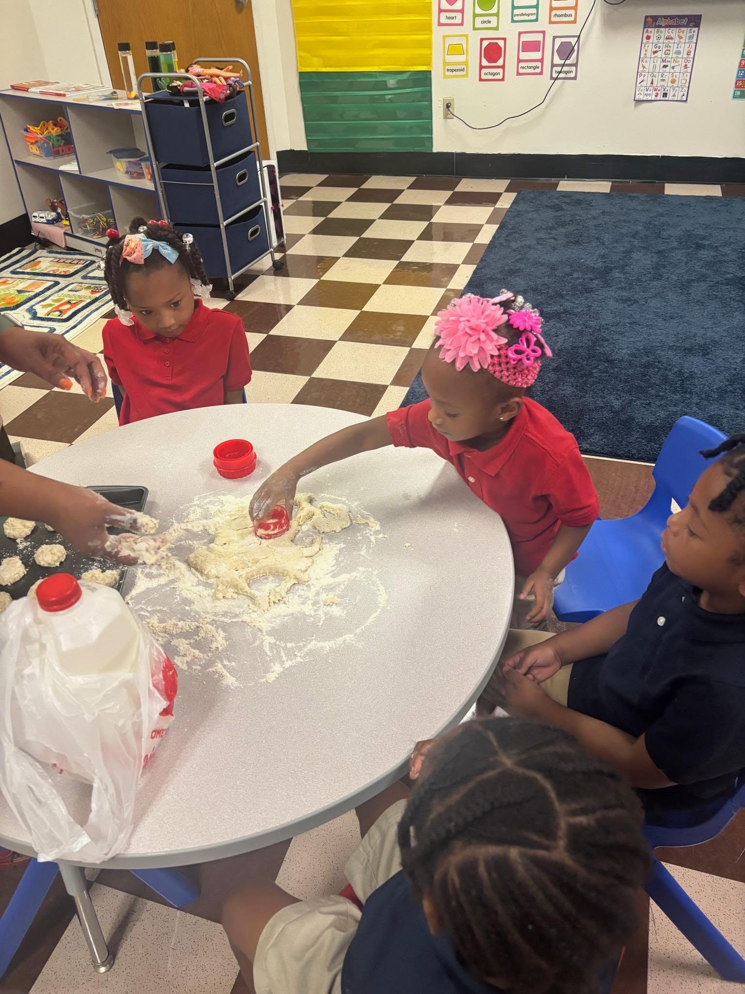Preschoolers making biscuits