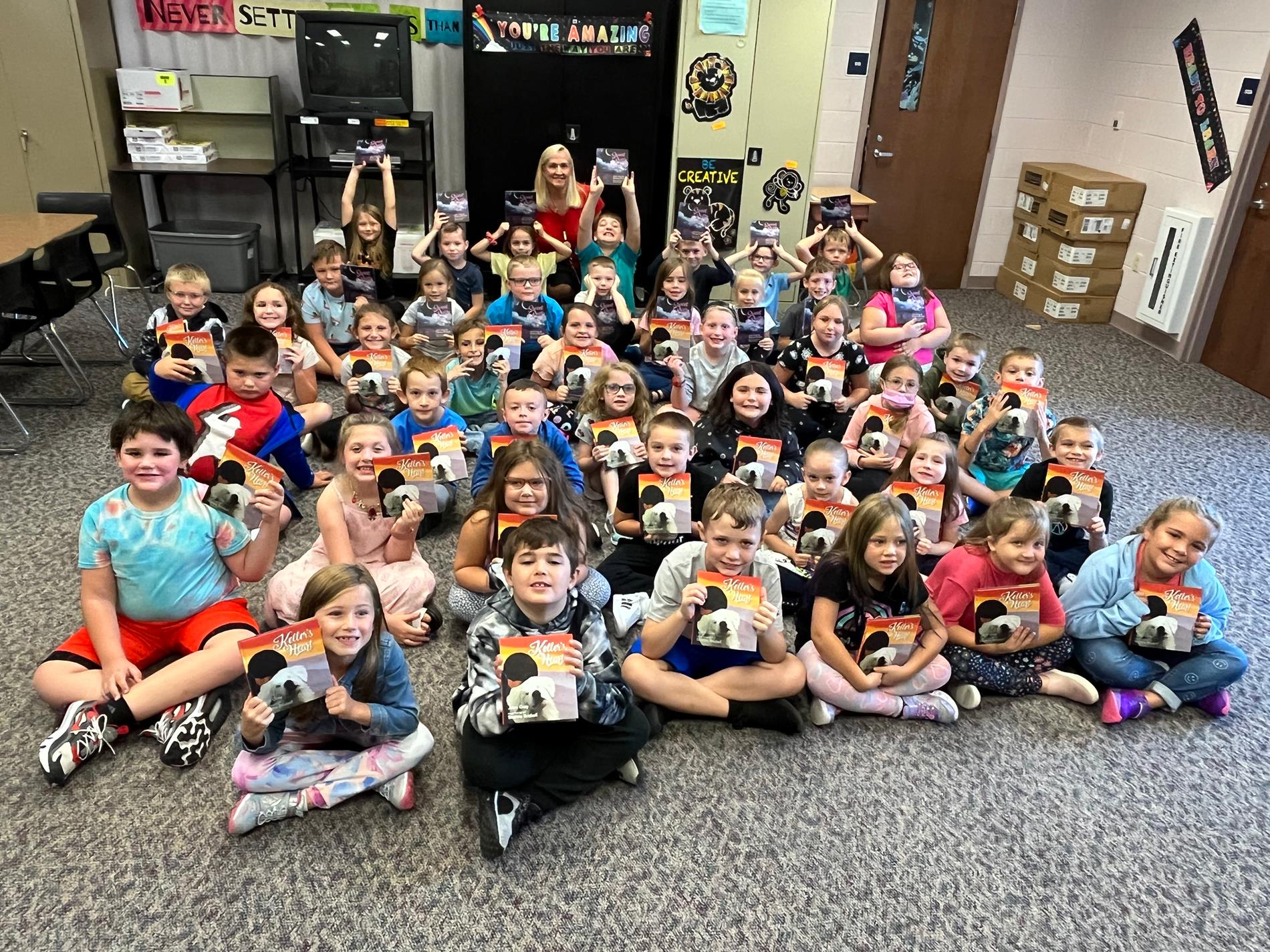 second graders with books