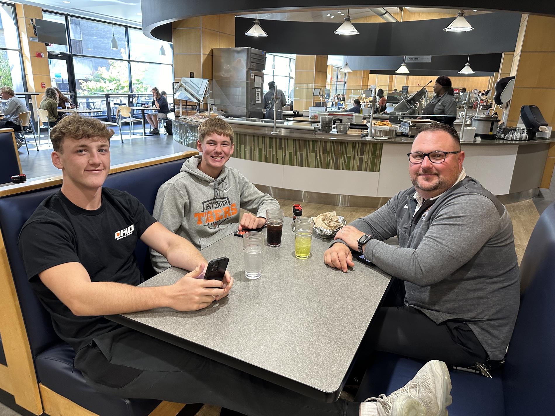 Mr. Radwan and students eating lunch on a UT visit