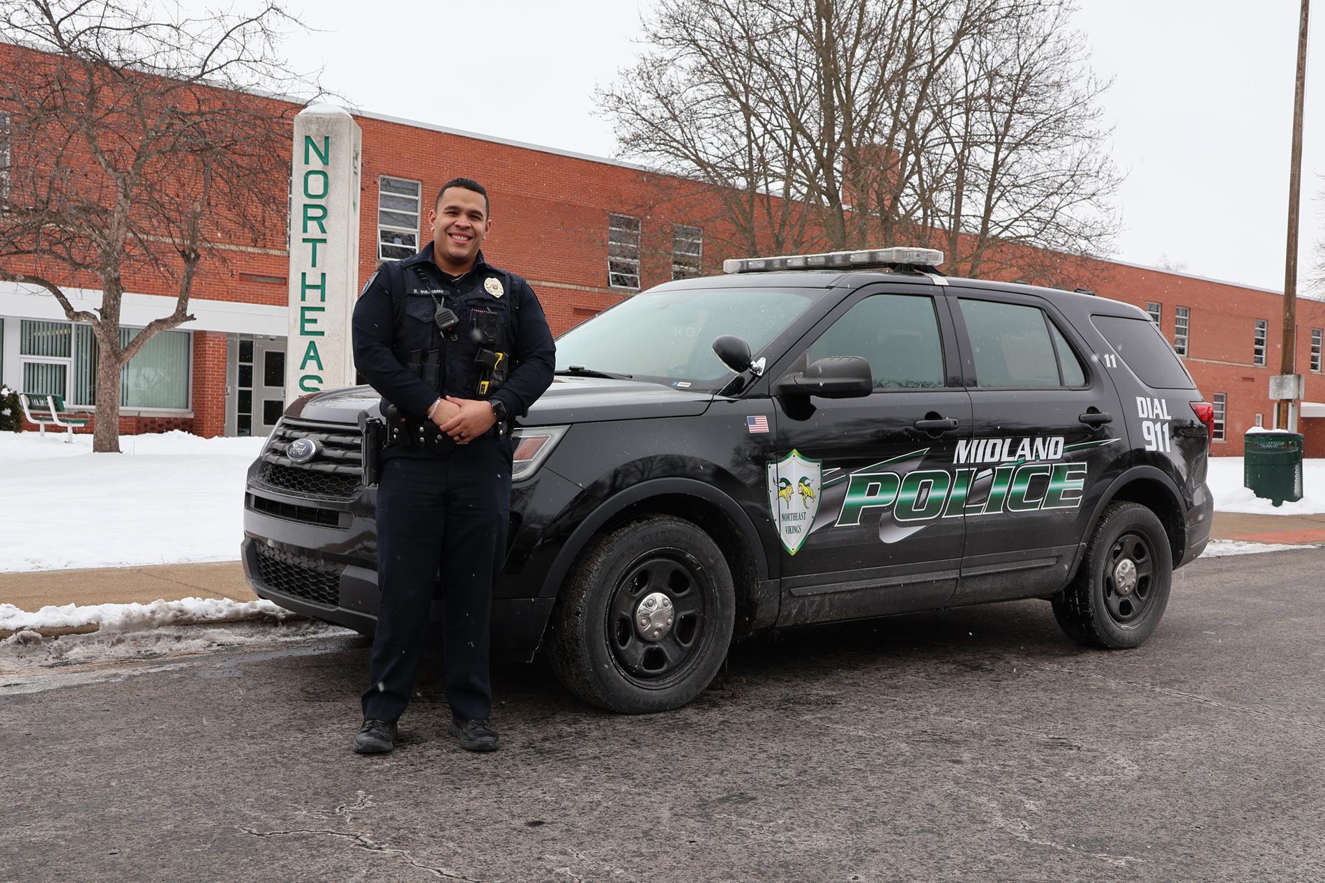 NMS SRO Dominic Williams outside Northeast Middle School