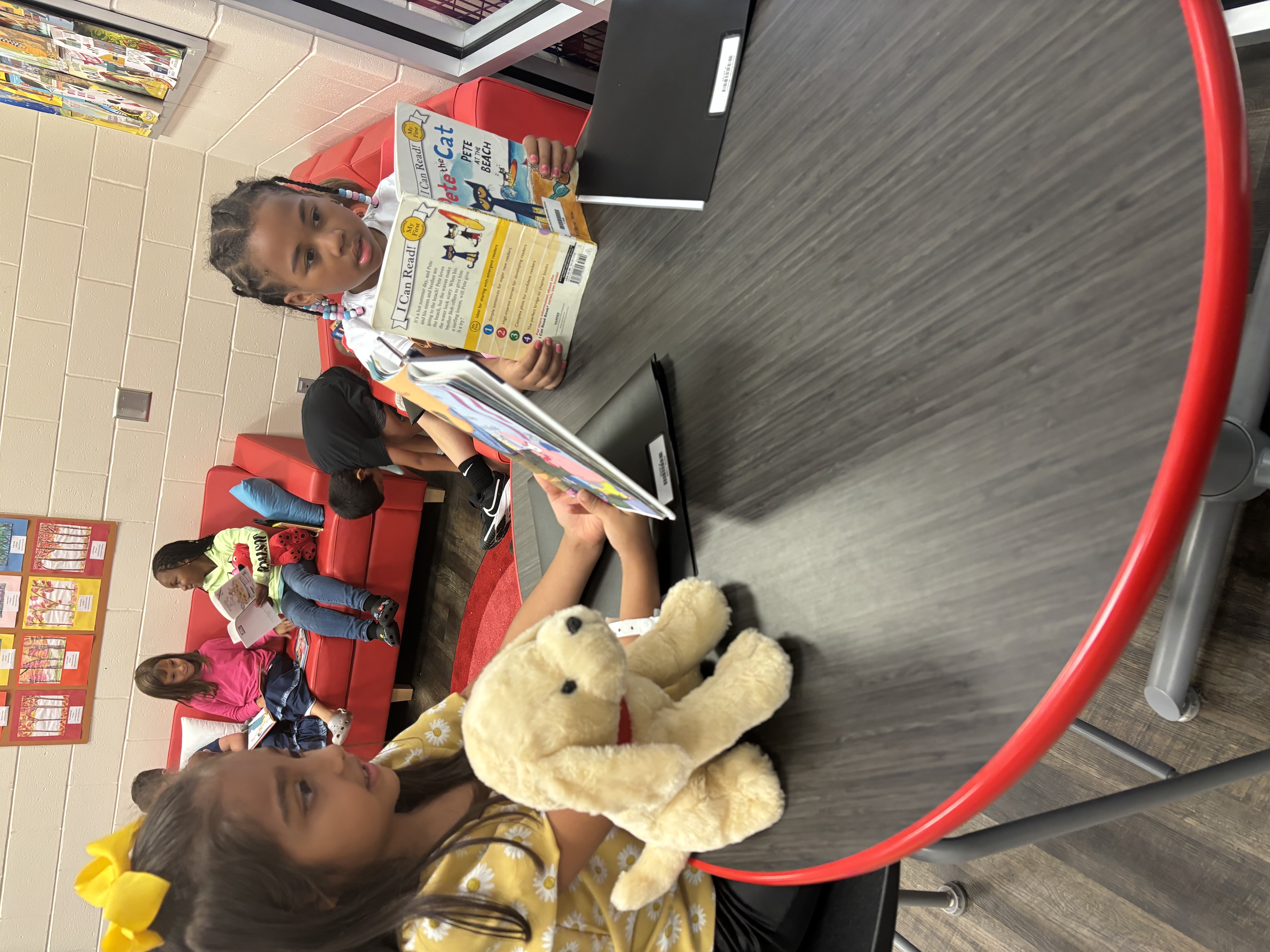 Student reading to book buddy