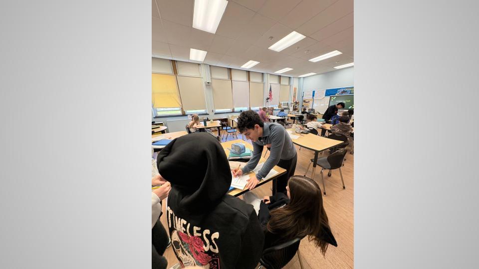 Peer mentors working with students