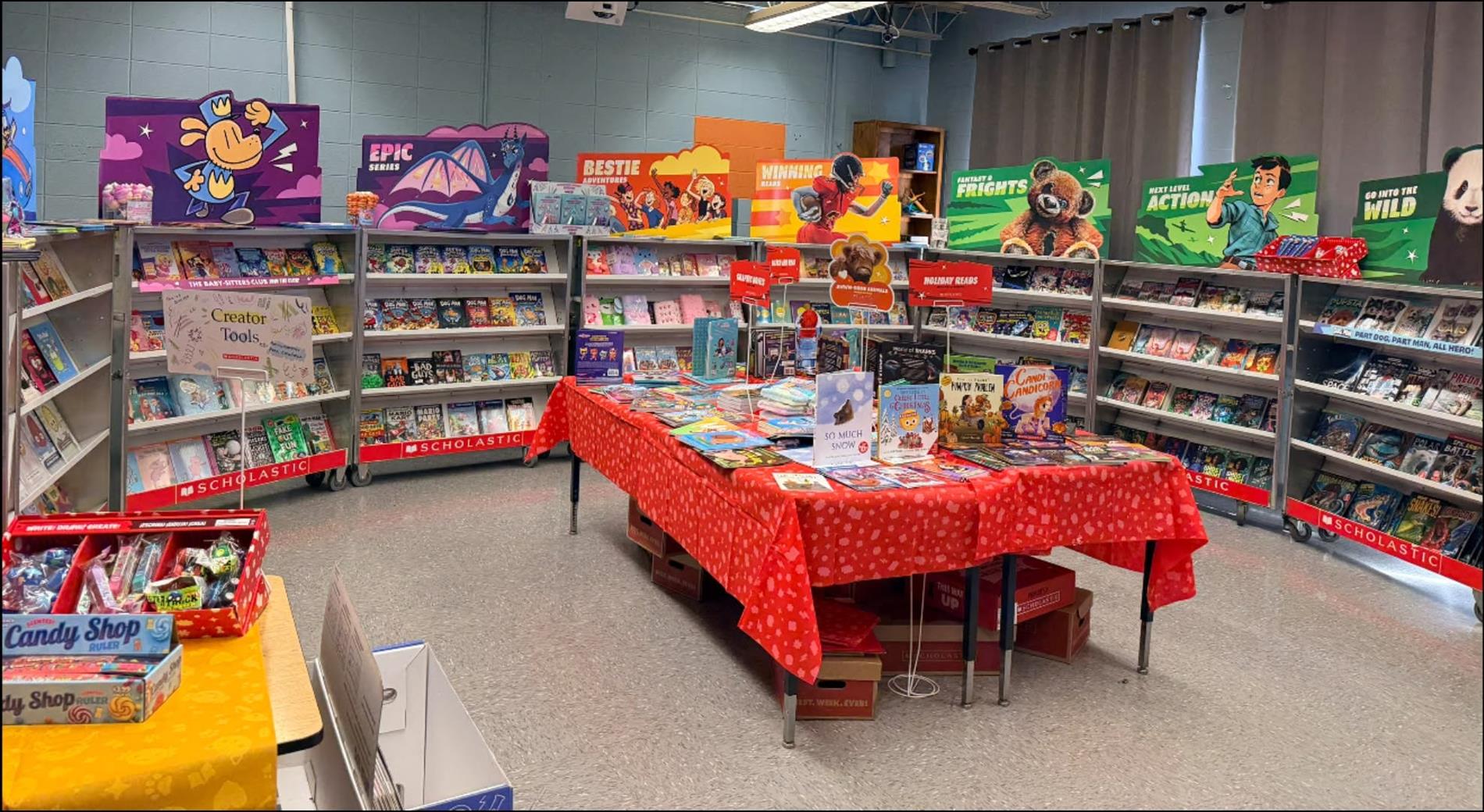 Scholastic Book Fair set up inside West Clay Elementary with shelves and tables filled with books and reading materials for students.