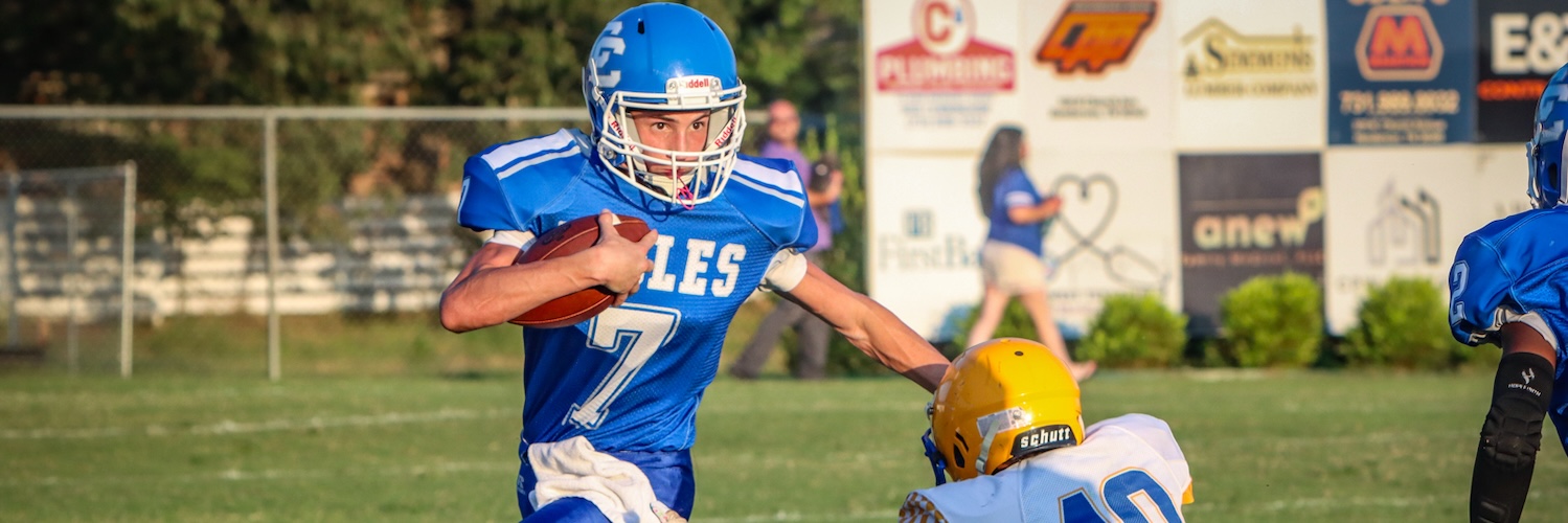 CCJHS Football player with the stiff arm