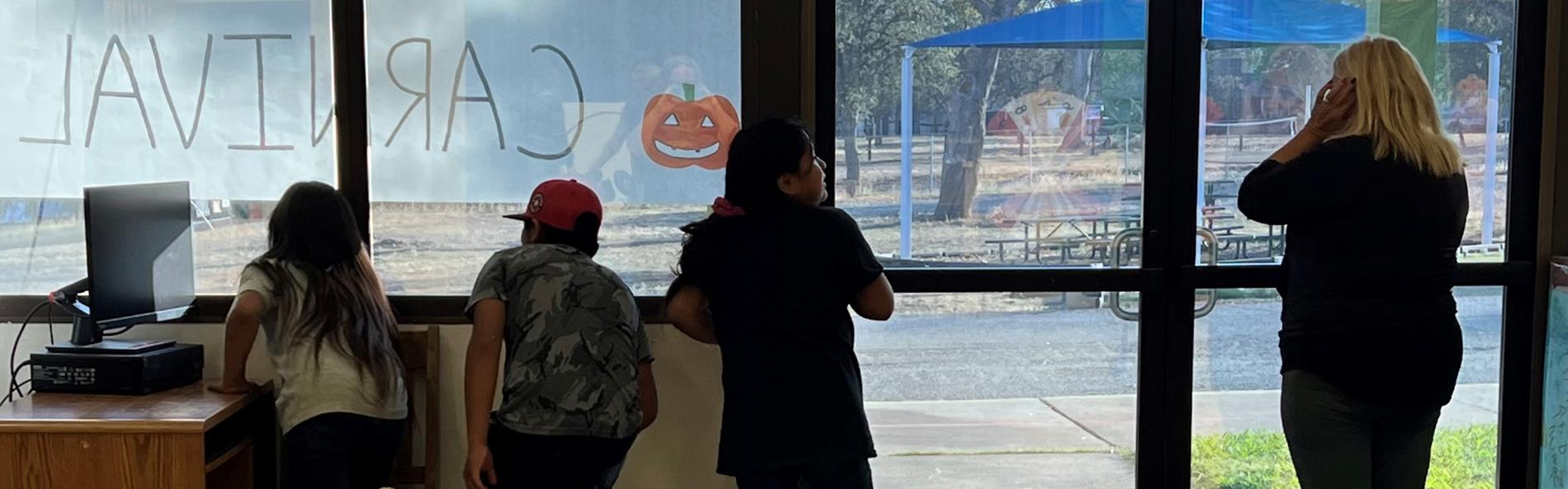 2022 Halloween Carnival - Ailani Fallis, Micah Felipe-Mitchell, Kynae Mitchell, Mrs. Walter excitedly waiting for Carnival to start