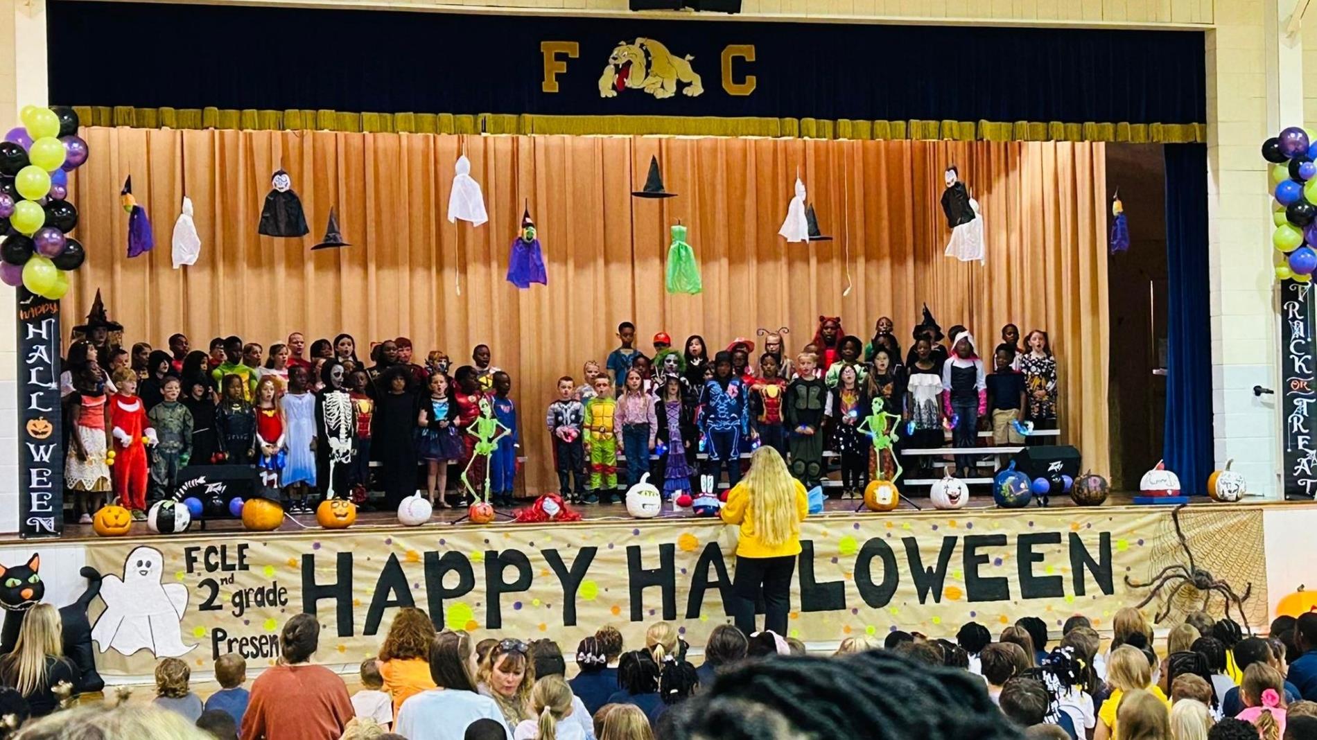 large group of students on stage