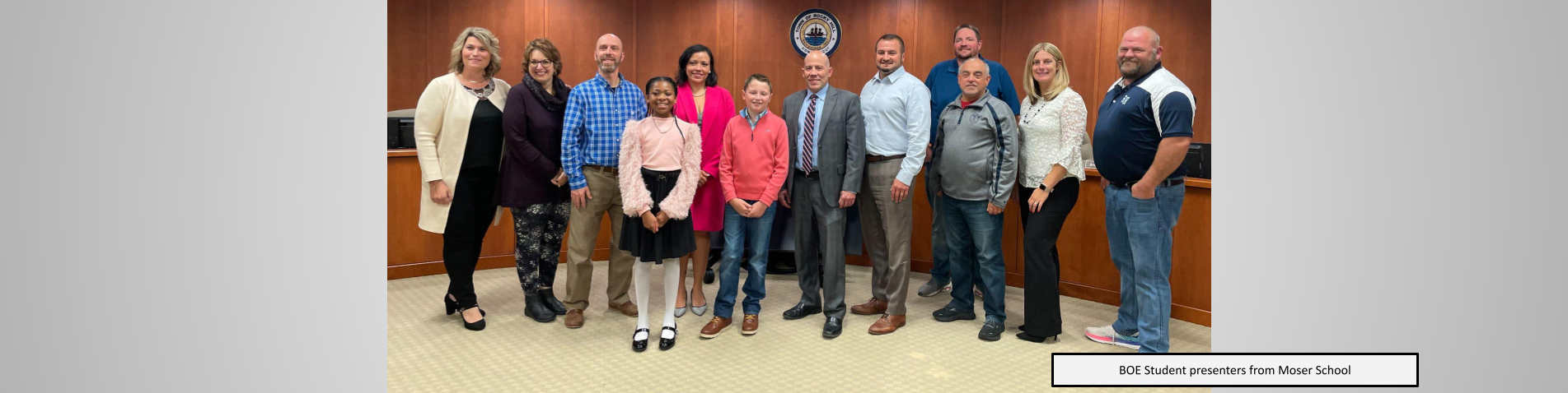 Moser student BOE presenters posing with BOE members