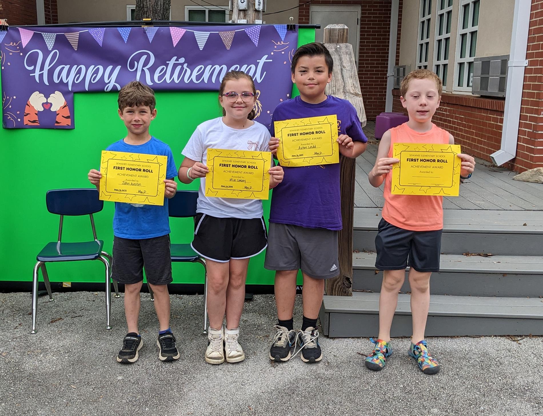 students holding academic awards