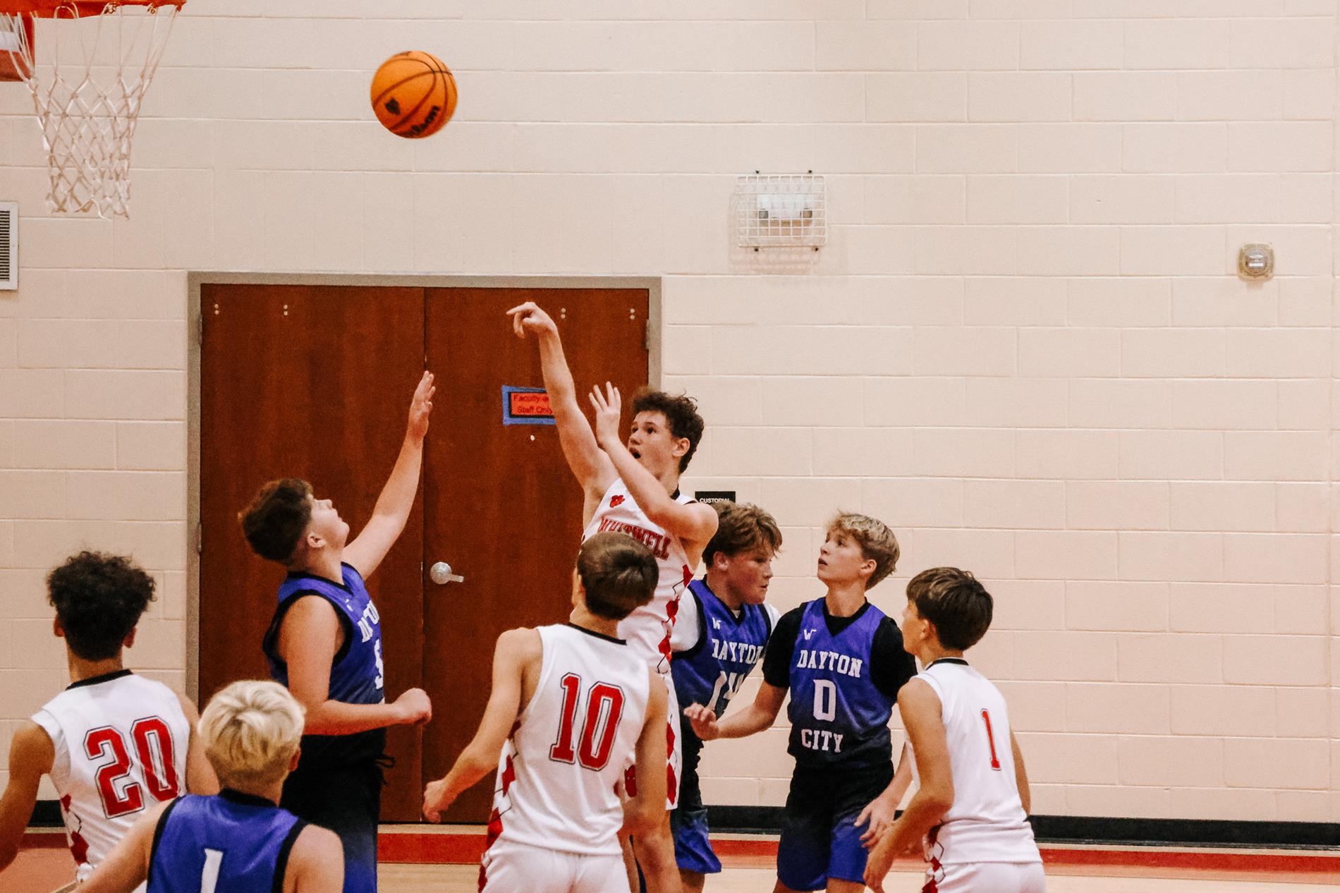 Boys basketball player shoooting