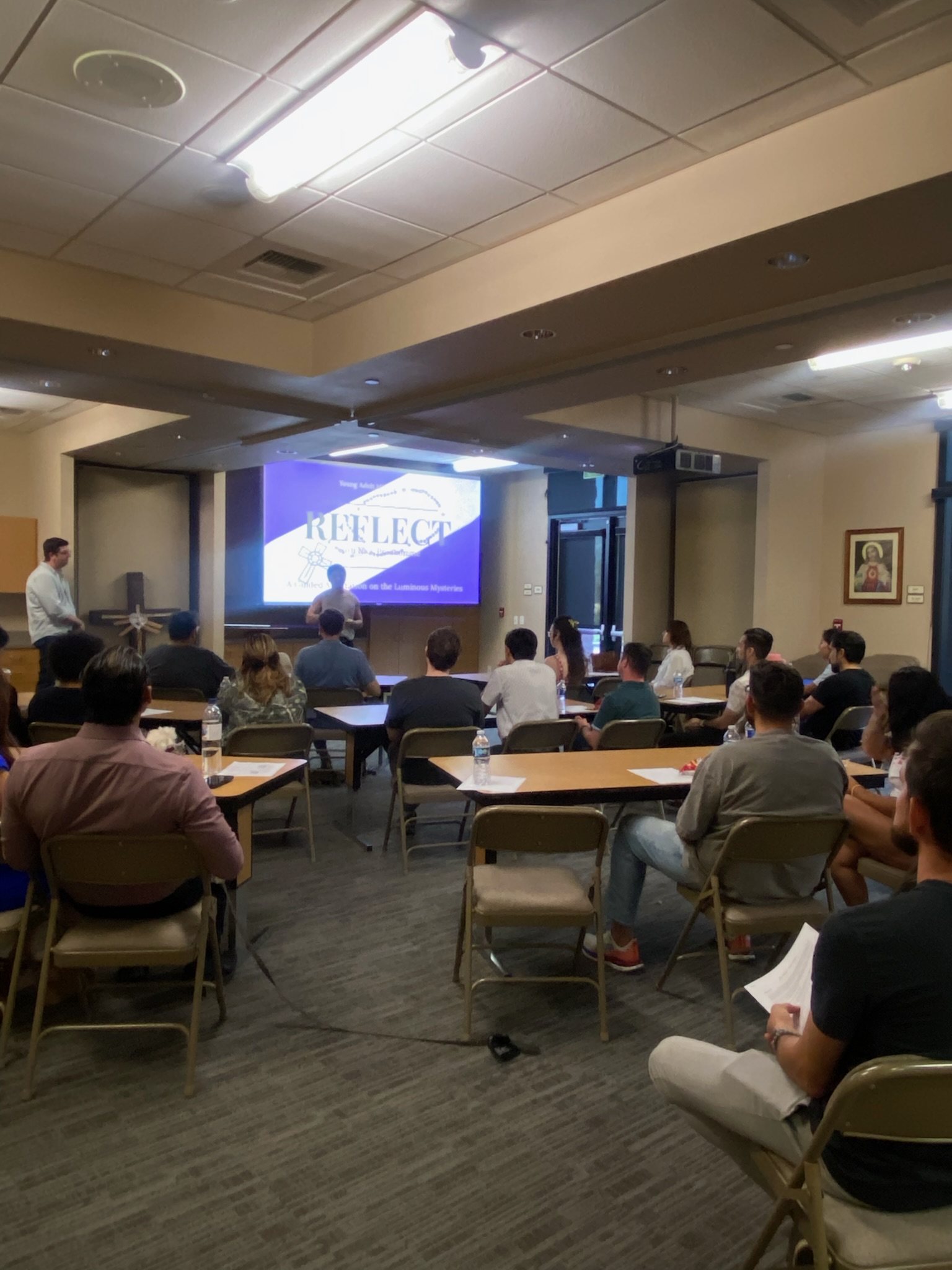 Young adults attending a Rosary night led by Nick Prudhomme