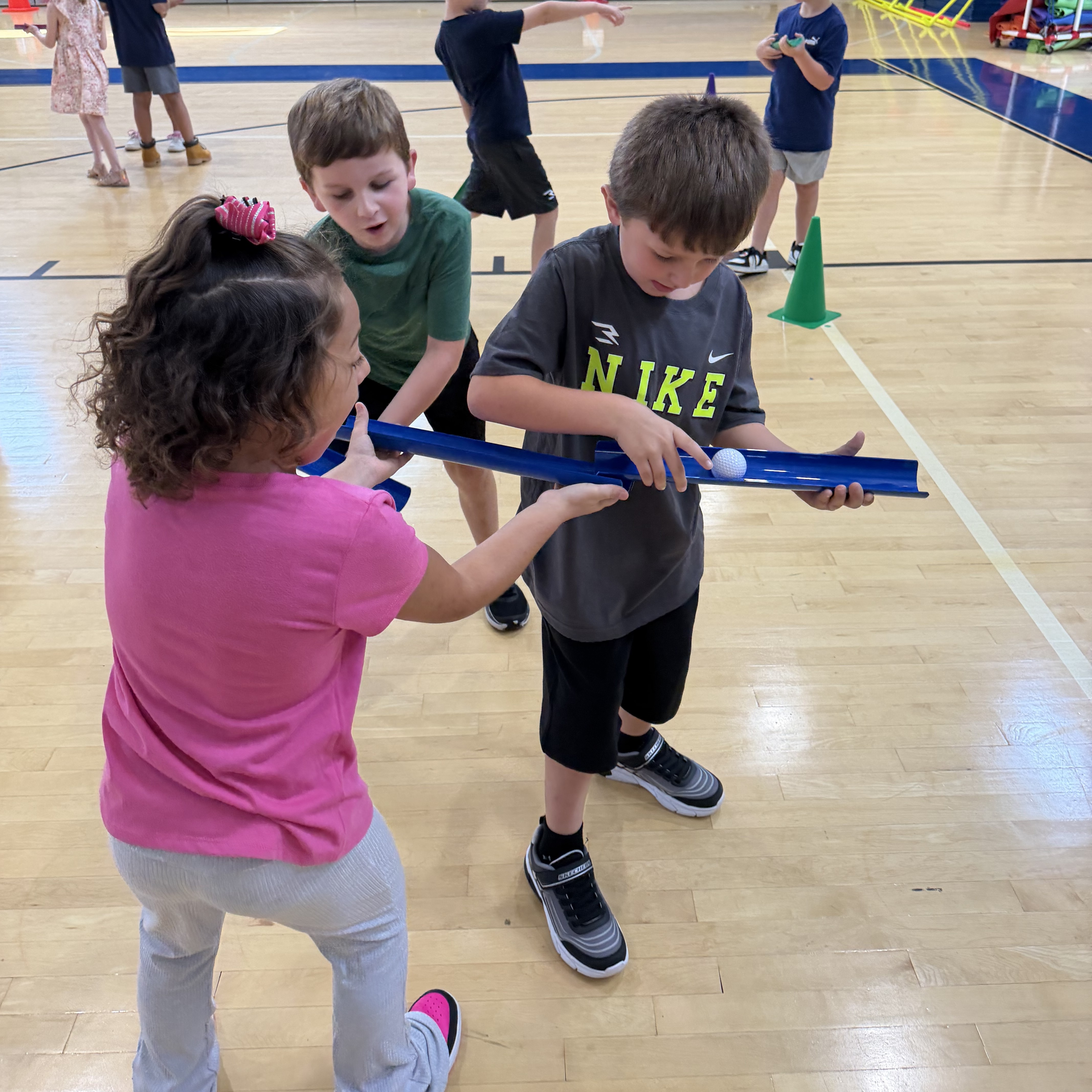 2nd graders working together in gym