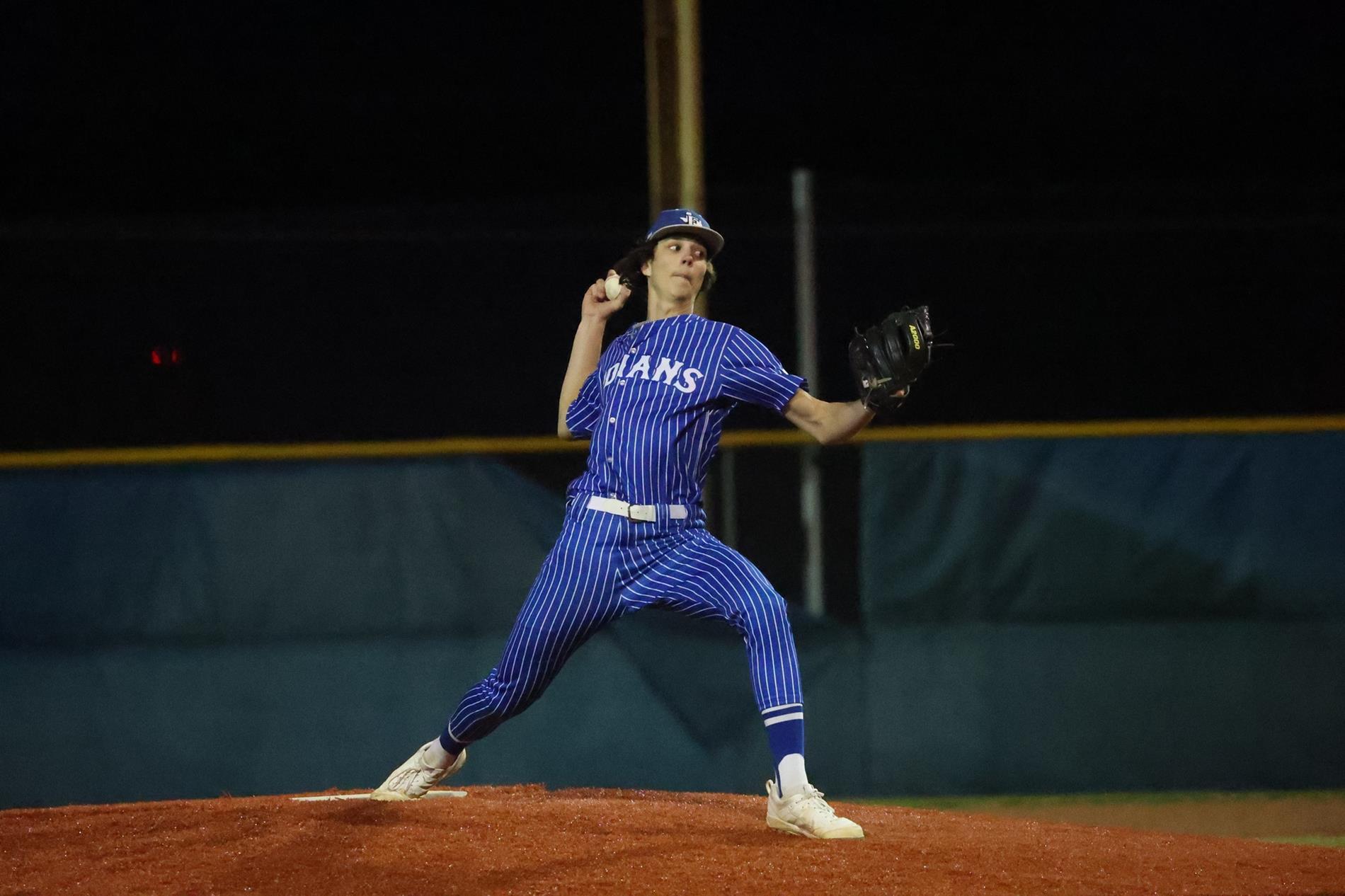 Student throwing baseball