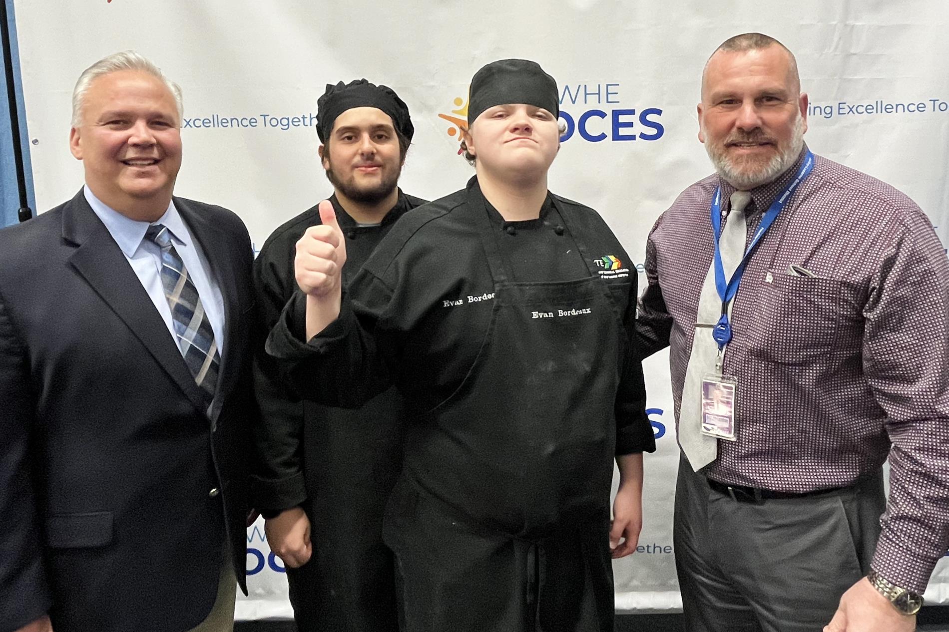 NYS Assemblyman Matthew Simpson and Superintendent Burgess Ovitt with two culinary arts students from Hadley-Luzerne Junior/Senior High School. 