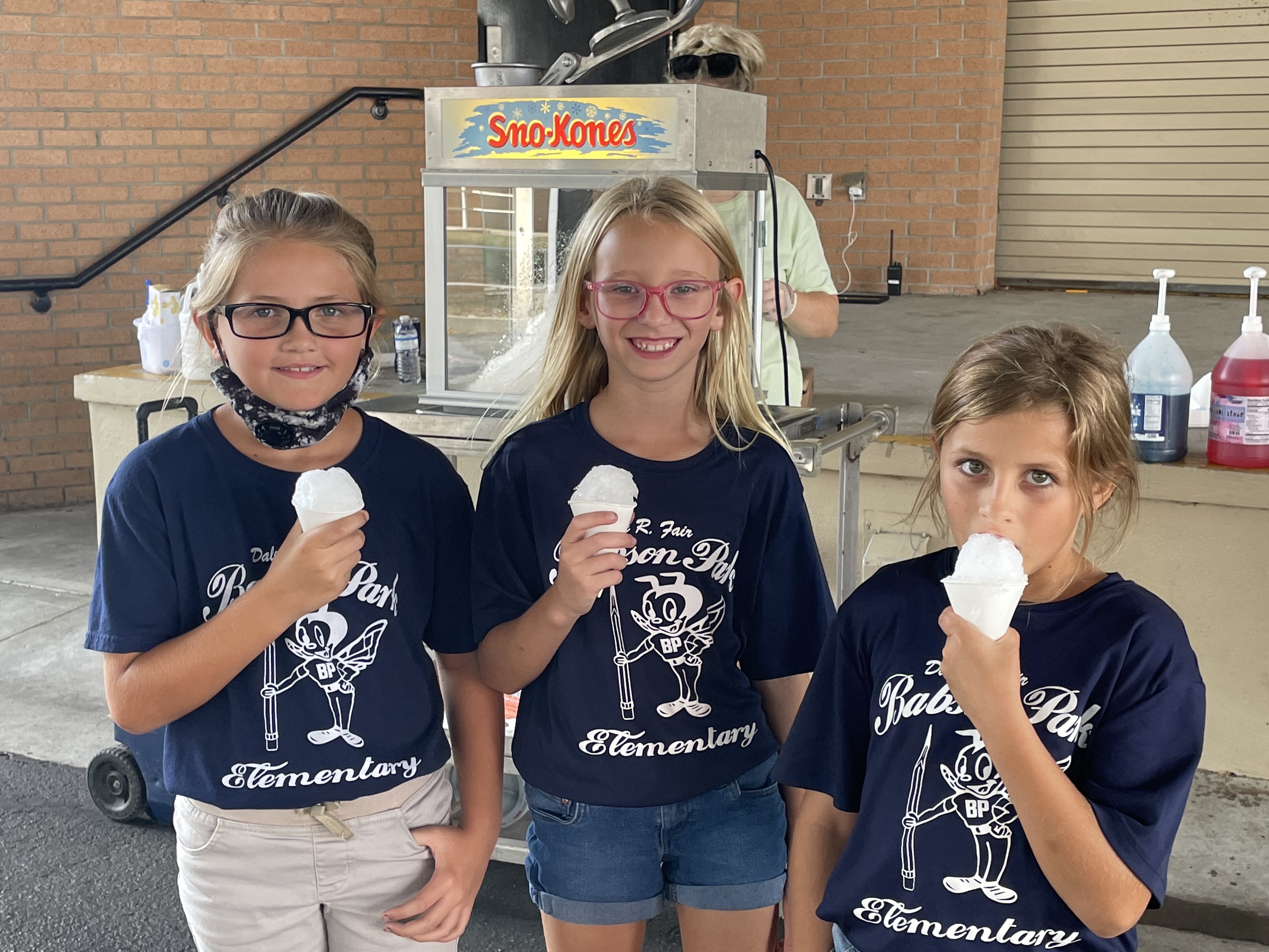 Students eating a snow cone