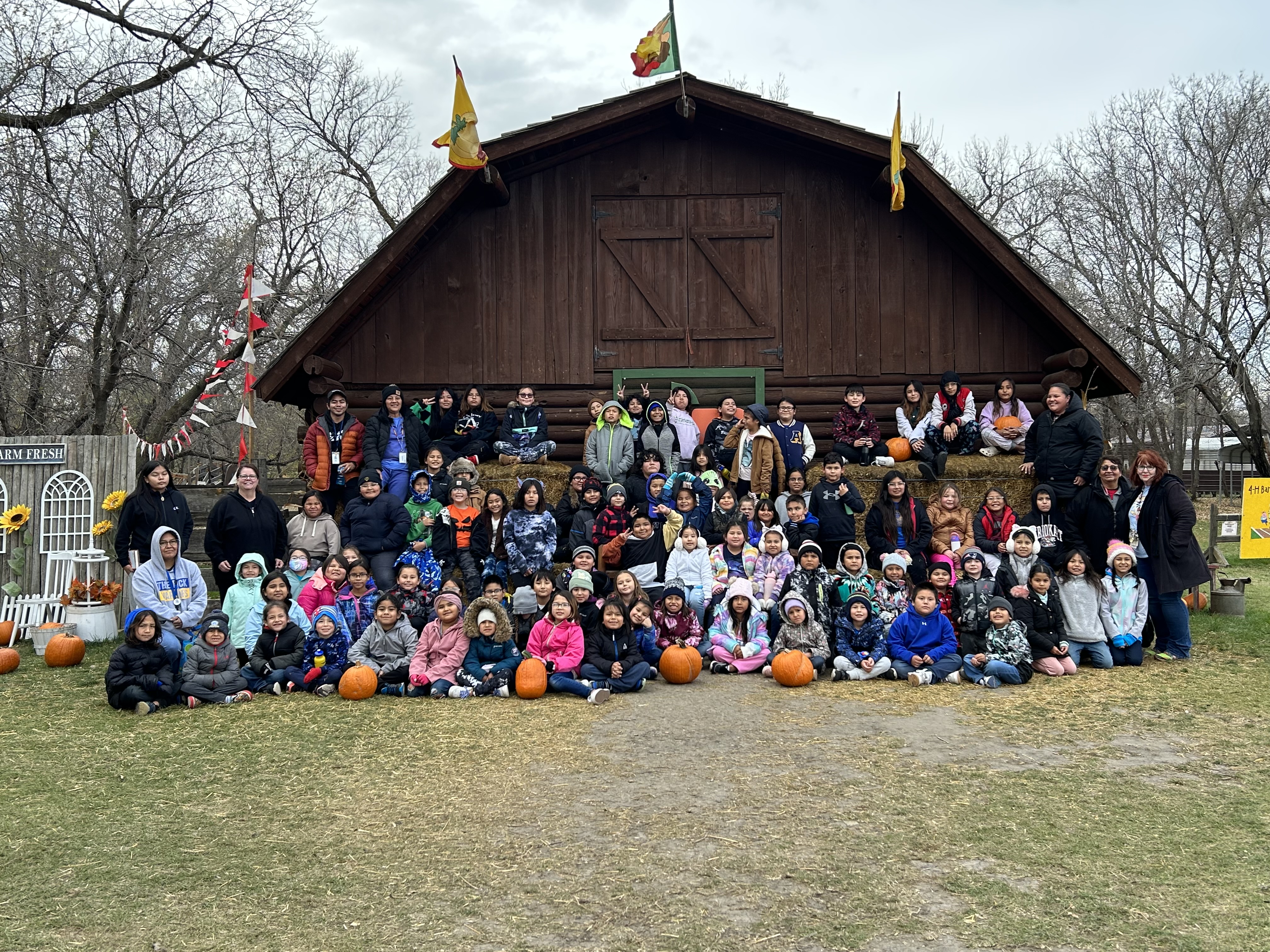 Students in front of barn at pumpkin patch