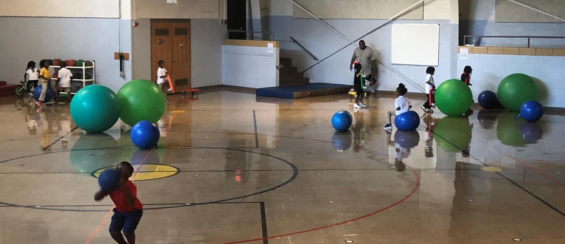 Kiddos enjoying Gym time with Coach Fry