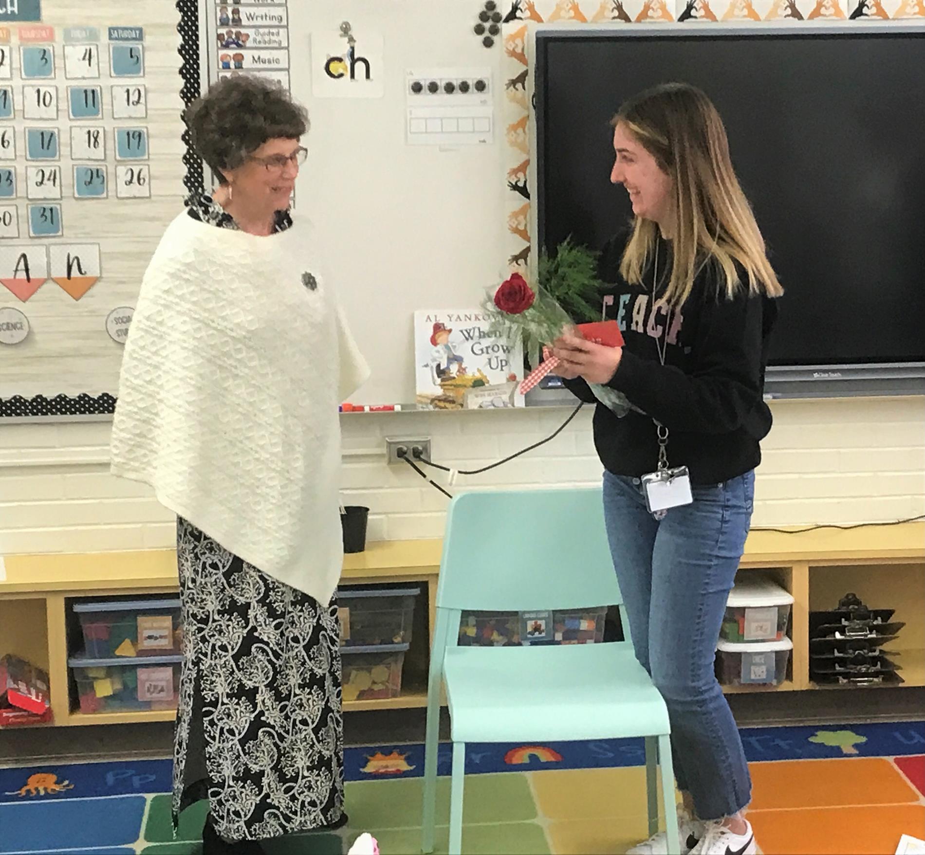 Kindergarten teacher Ms. Savona receives a Buzzing Bee award from Delta Kappa Gamma