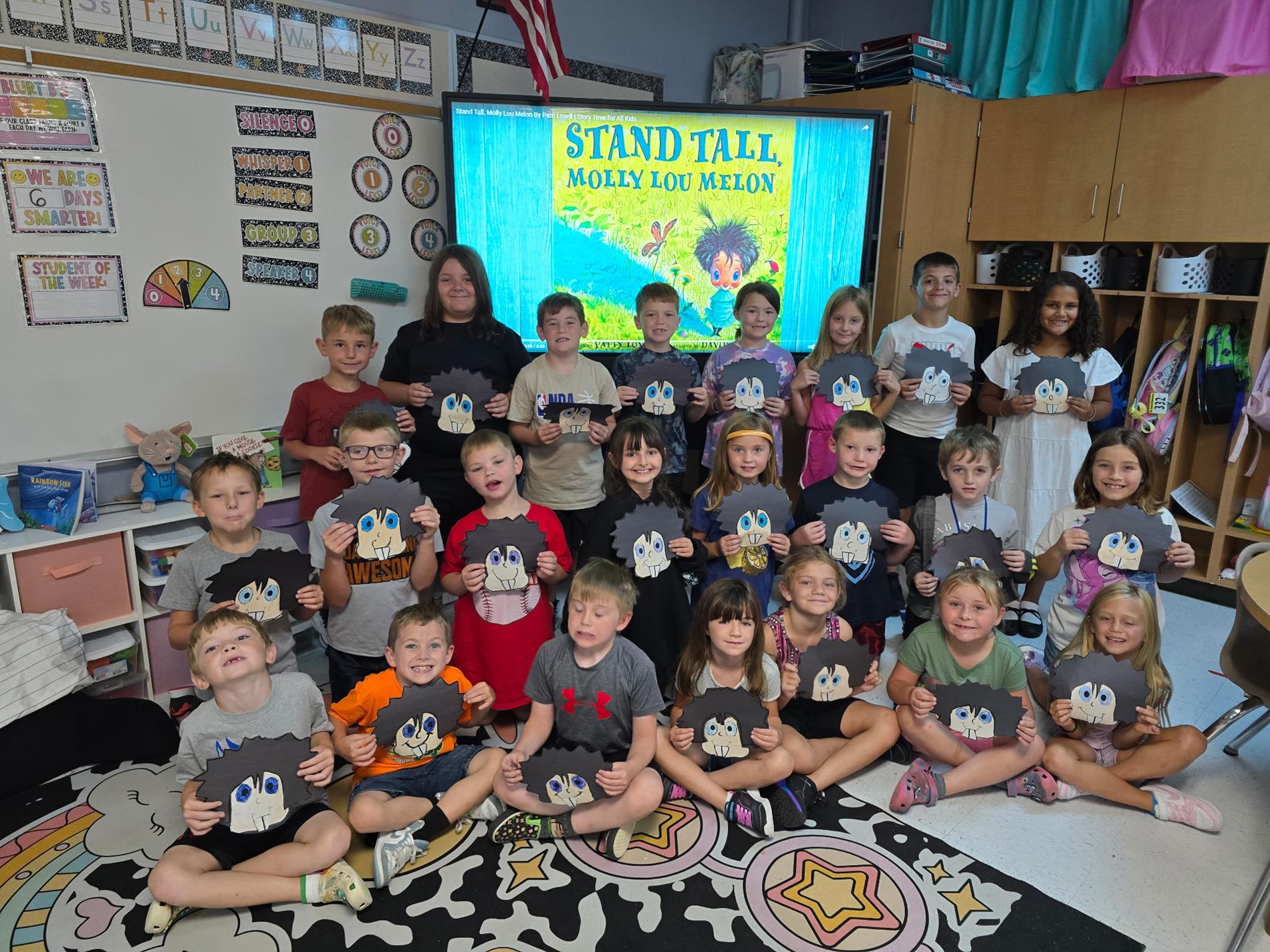 students holding molly lou melon craft