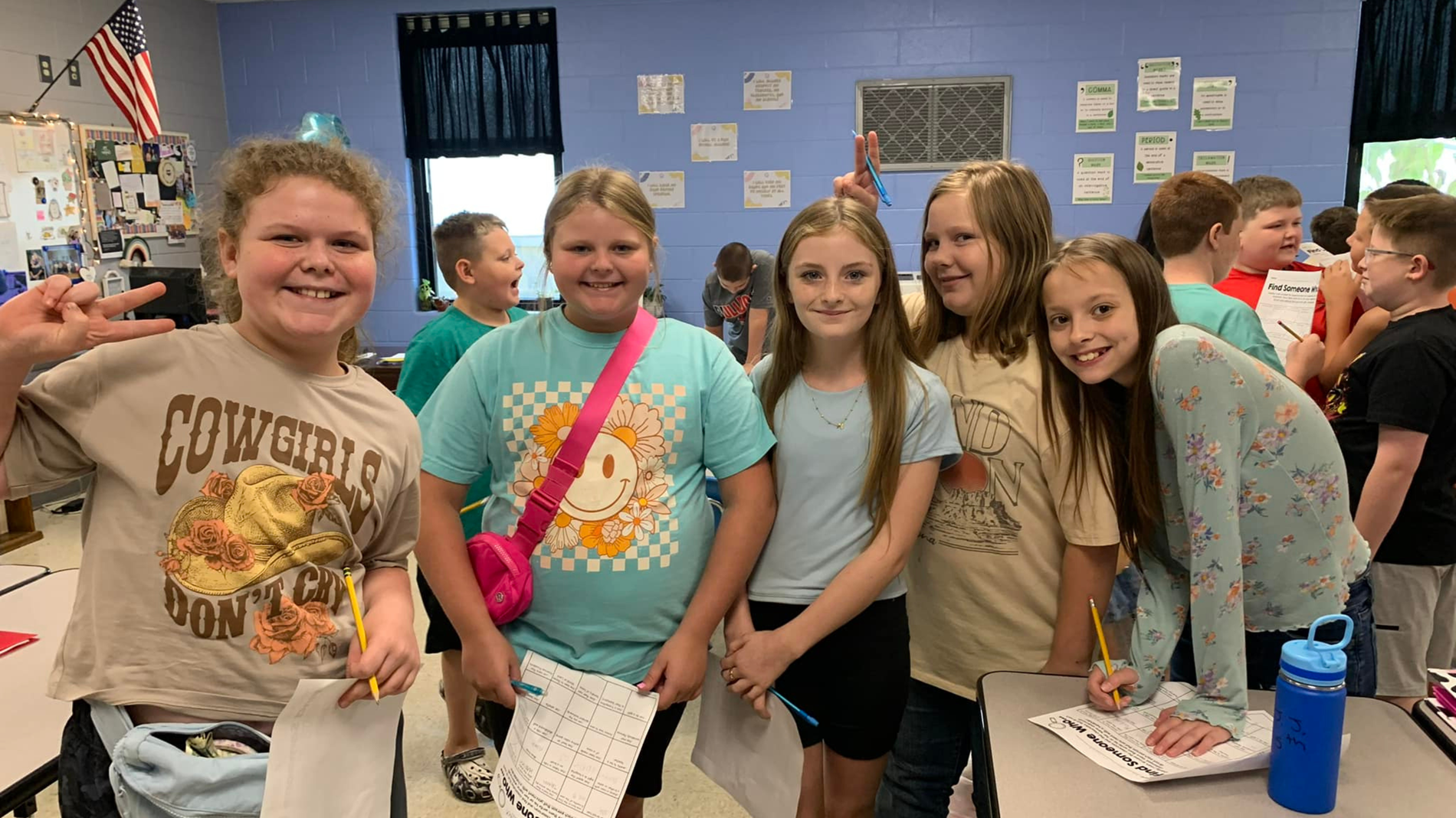 Students stand for a group picture during their math activity.