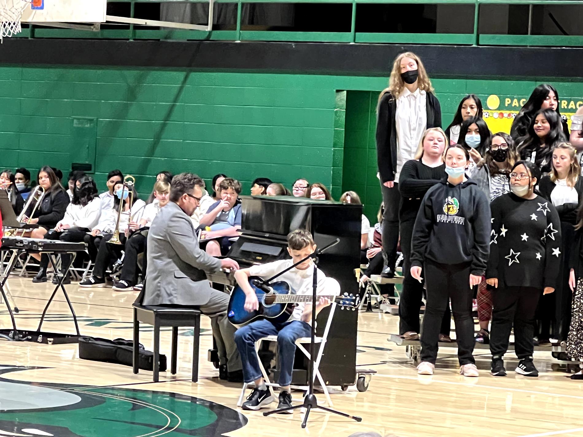 Students in band and choir during Christmas concert