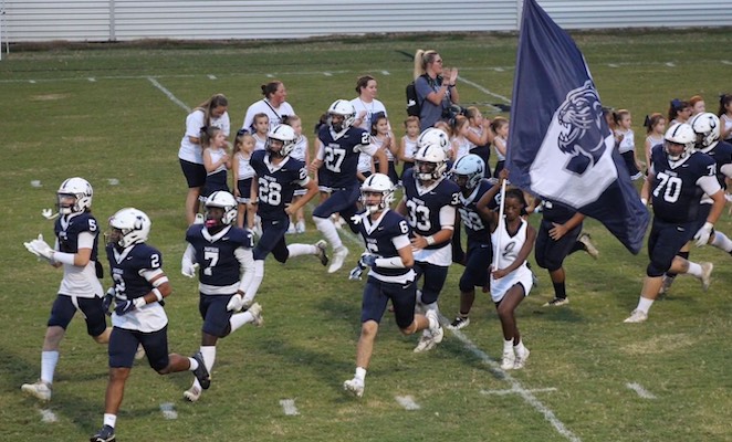 Football team taking the field 2