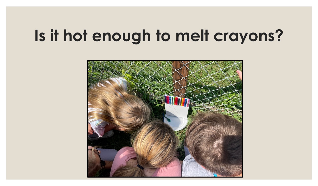 students looking at melting crayons