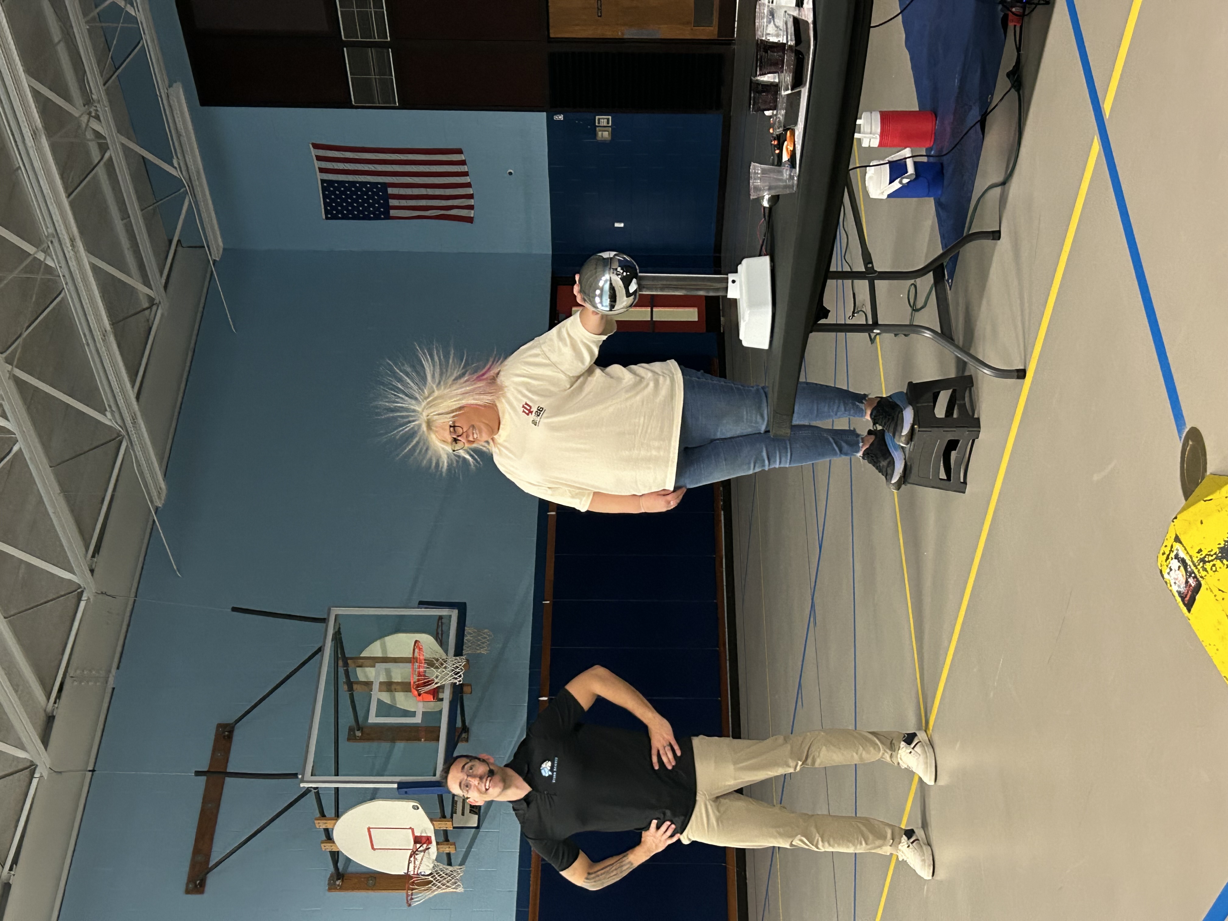 static electricity makes a teacher's hair stand up