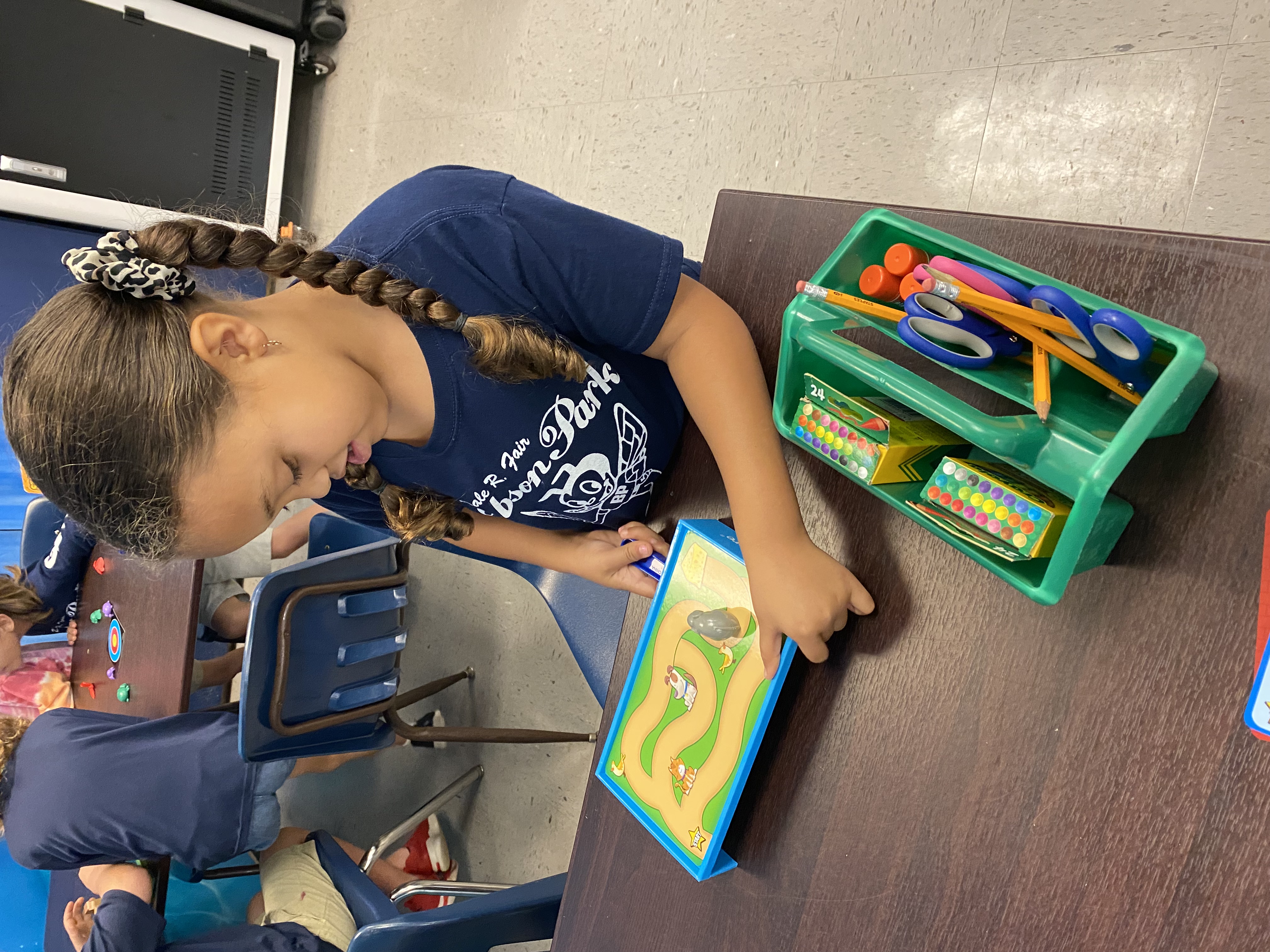 1st Grade students exploring magnets.