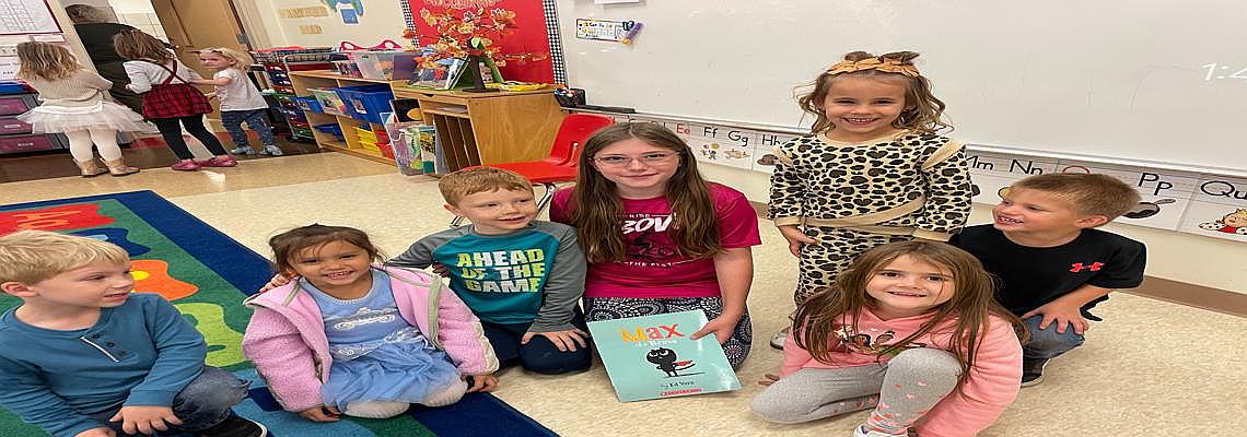 Sydney Gibson cashed in her Brag Tags and read to the pre k class