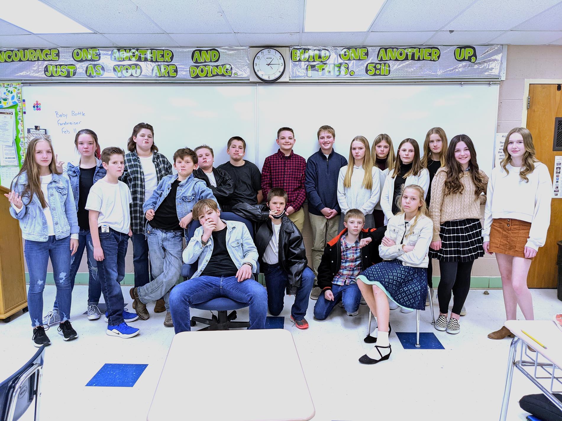 Middle school students dressed as characters from the book, "The Outsiders".