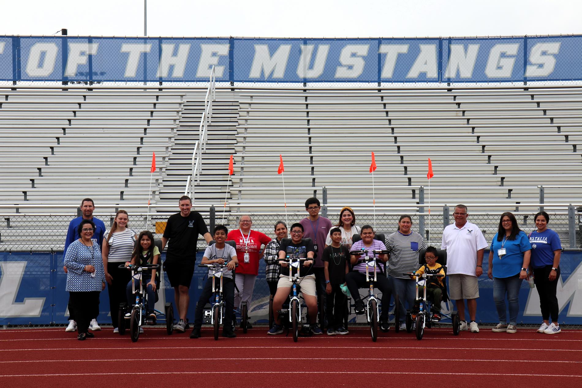 Students riding the adaptive bikes donated to the school