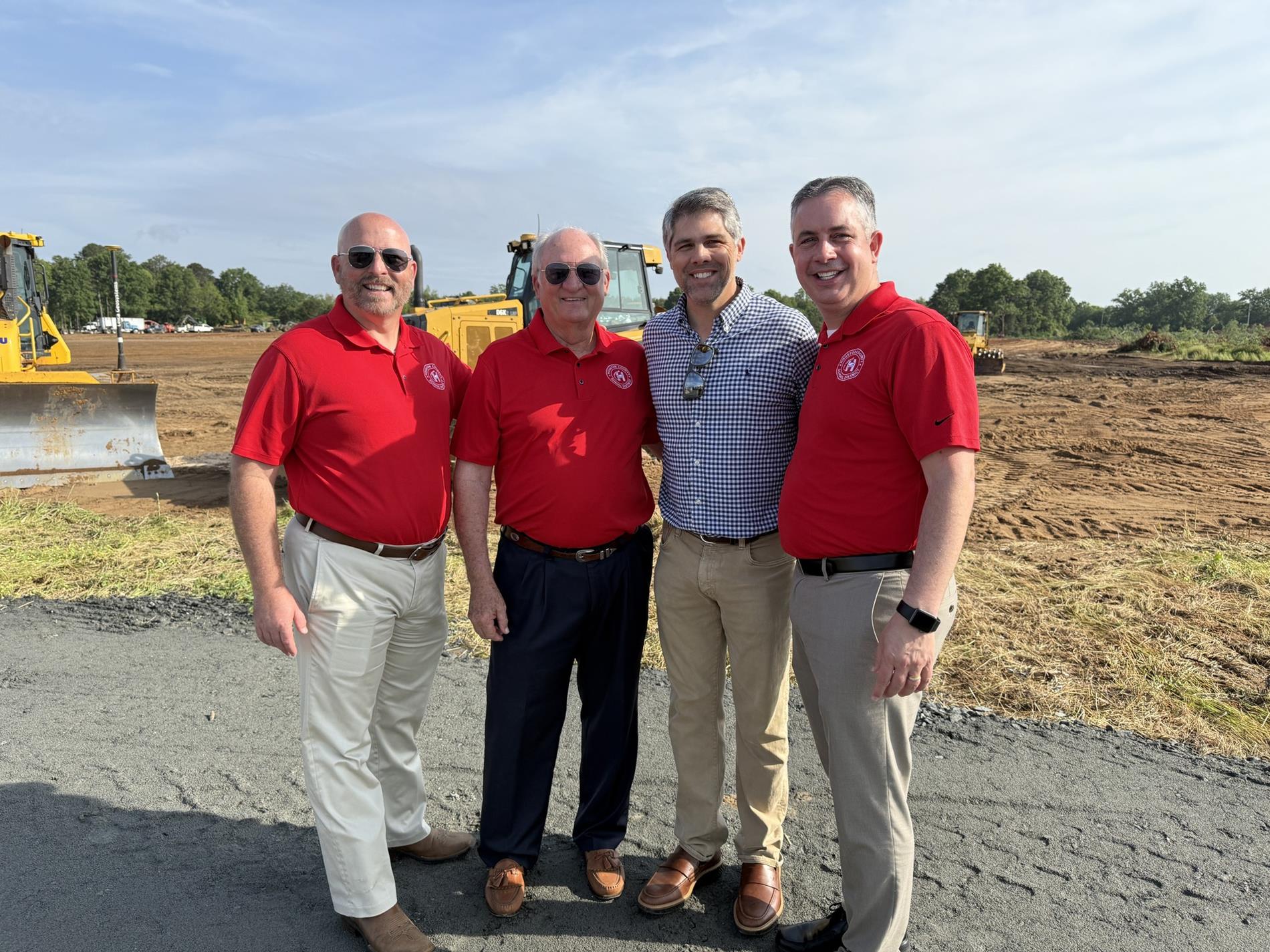 Dr. Elgin Mayfield, Board member Dave Crockett, Representative Shaw Blackmon, and Dr. Rogers
