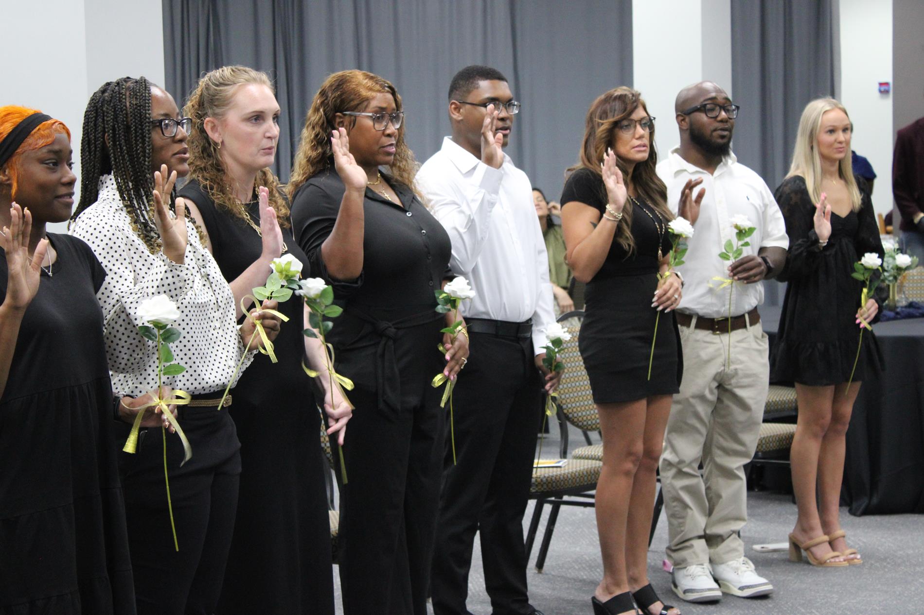PTK Members are sworn in.
