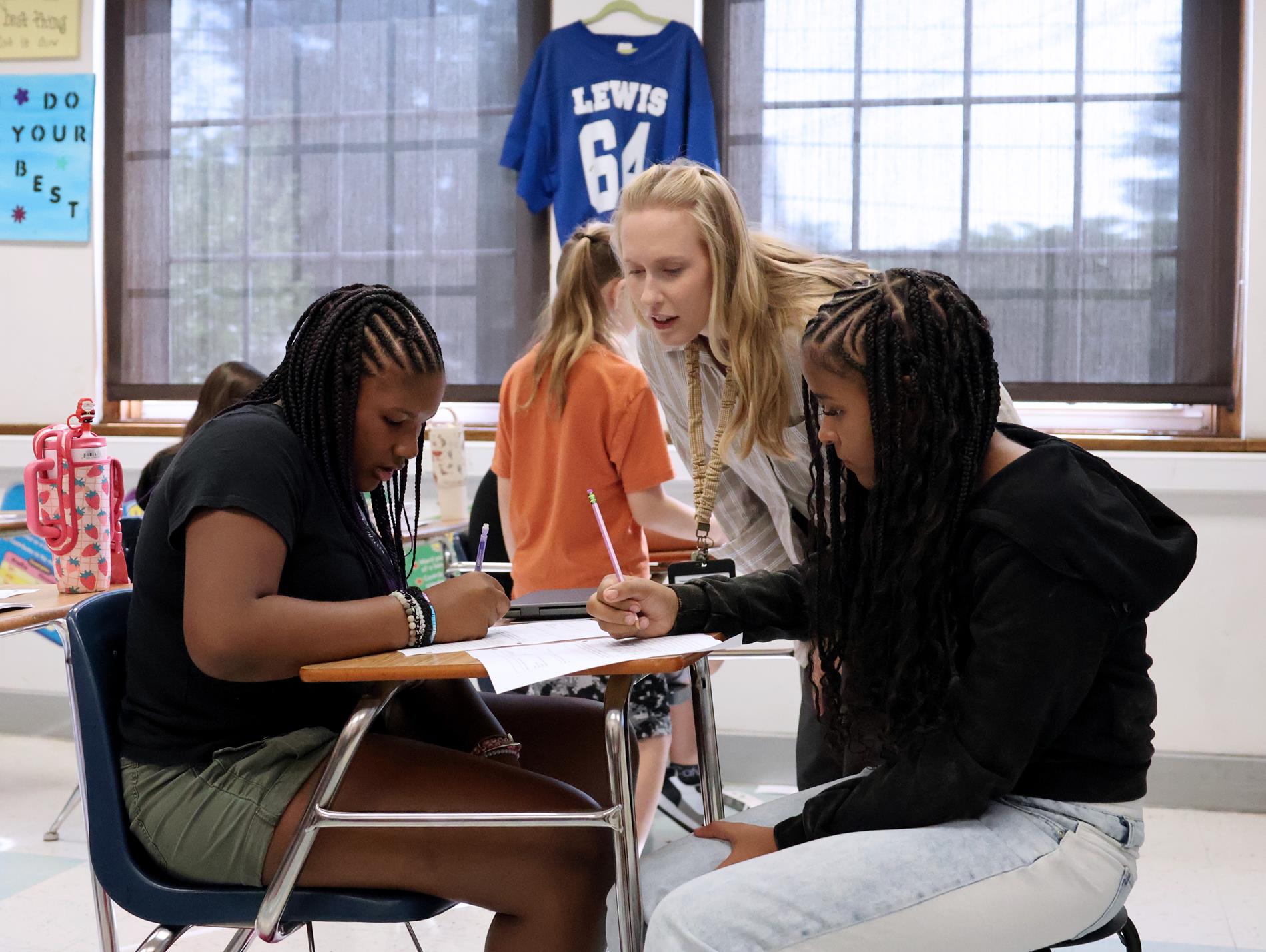 Teacher working with students