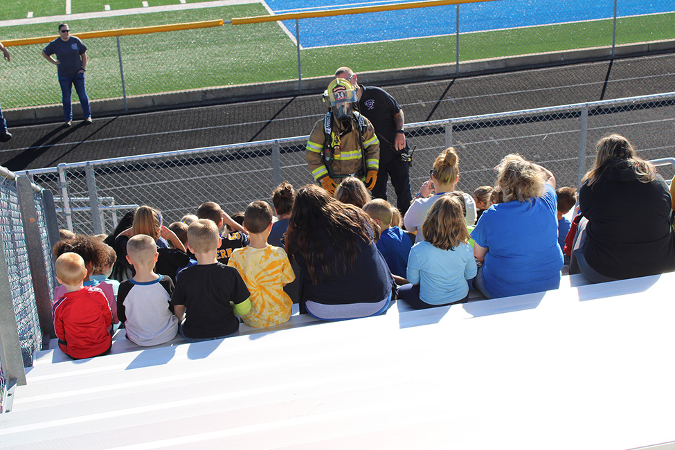 Chief Cole and junior fire fighter, Chase Utt demonstrate the equipment