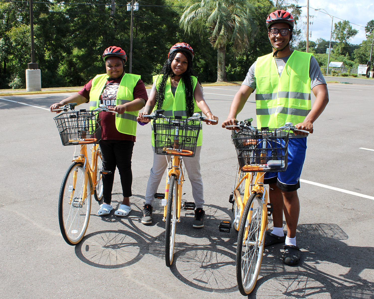 L-R - Alyssa Rogers - Tison Bennett - Jadon Autuneh-EL with new bikes for the Reid Ride Bike Program