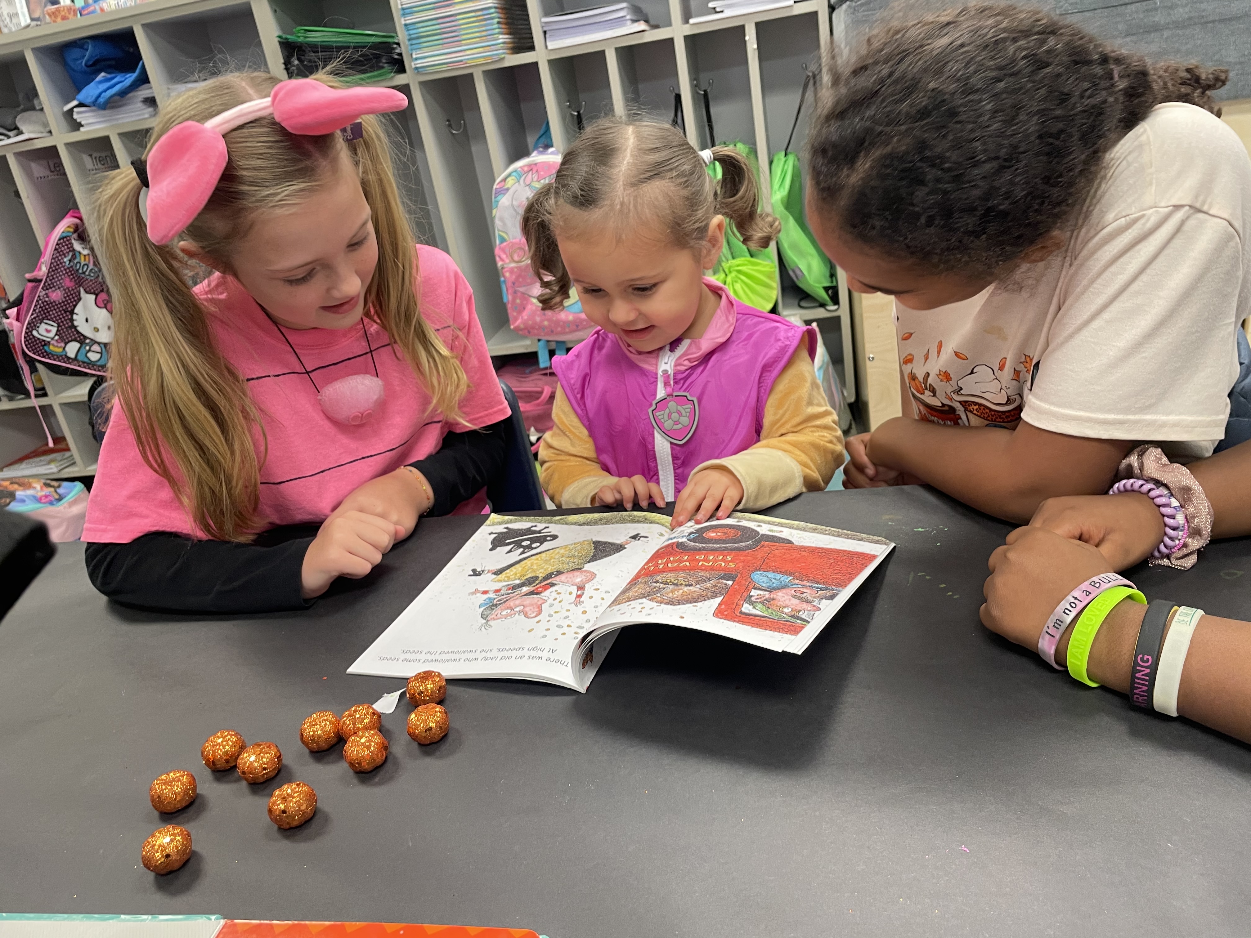 Older Students pair with younger to read to them