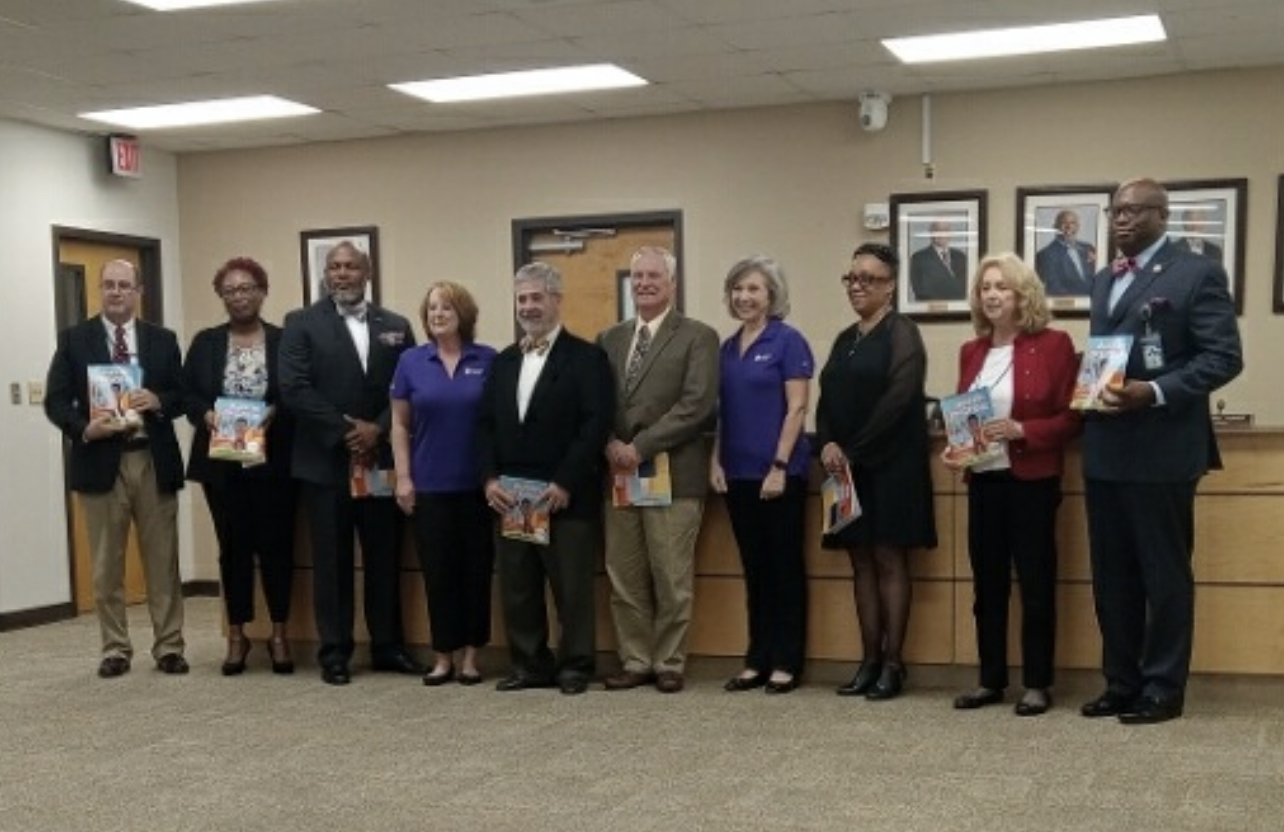 Dominion Energety Book Donation Presentation with the Board