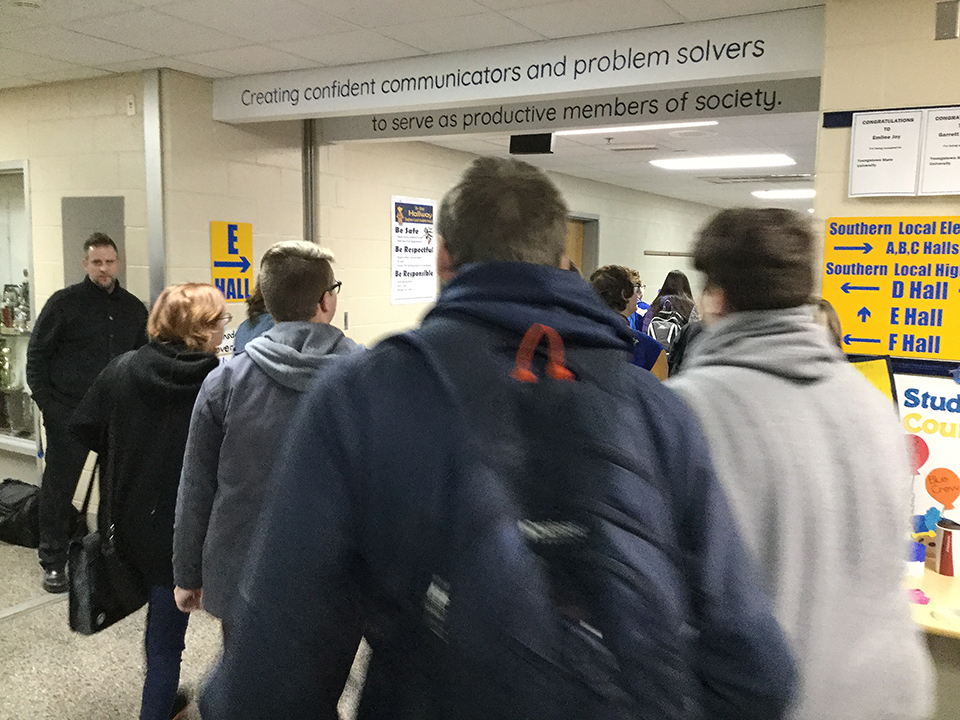 students enter the hallway