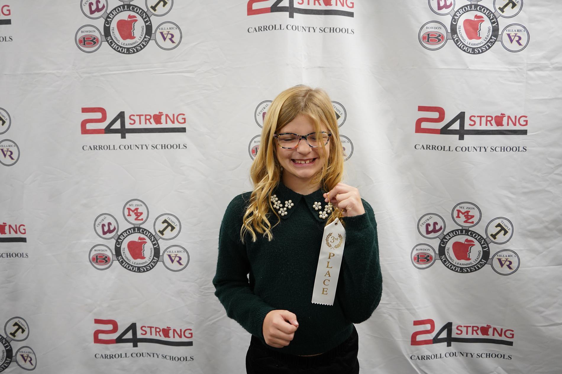 Student with third place ribbon