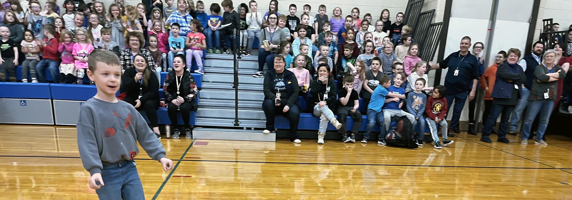 excited boy at assembly