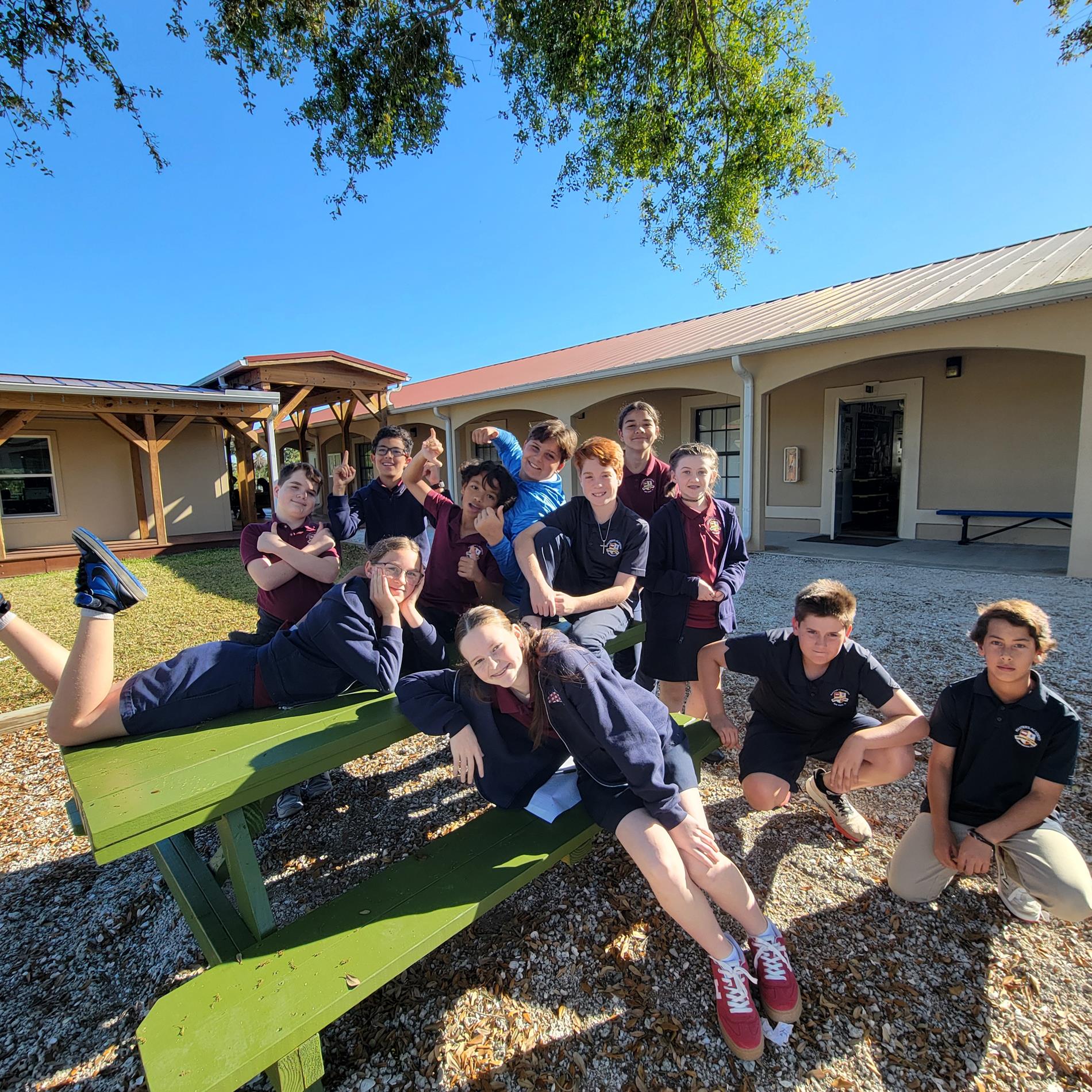lower school students posing outside for photo