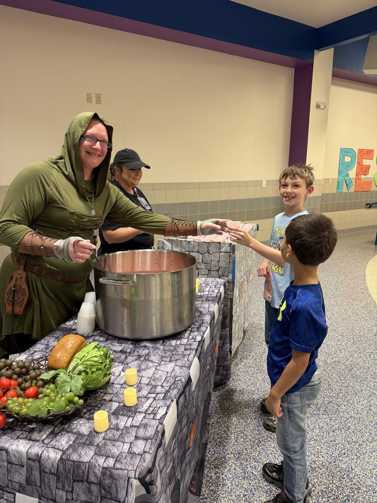 elementary students at a presentation on new foods in the cafeteria