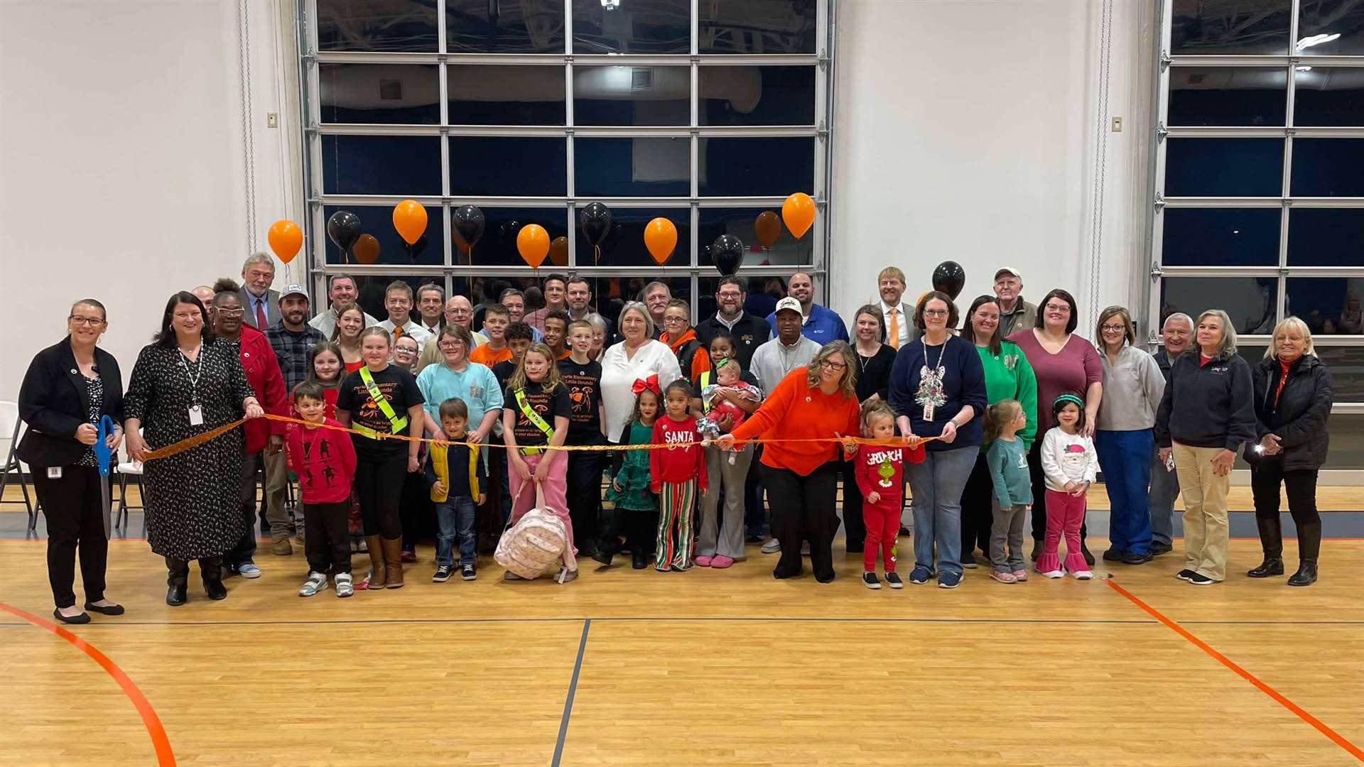 ribbon cutting group of people